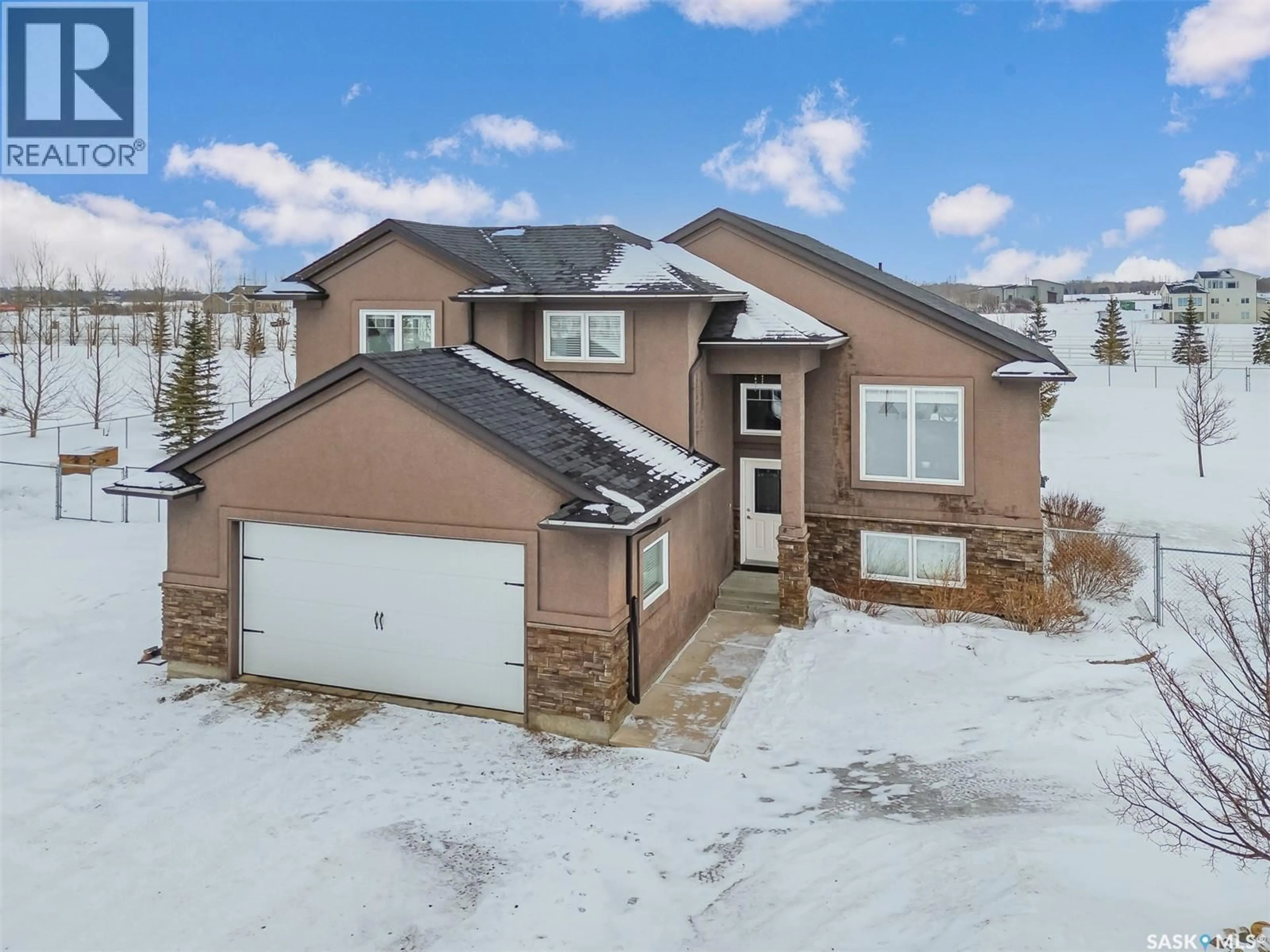 A pic from outside/outdoor area/front of a property/back of a property/a pic from drone, street for 19 COUNTRY LANE, Dundurn Rm No. 314 Saskatchewan S7C0A7