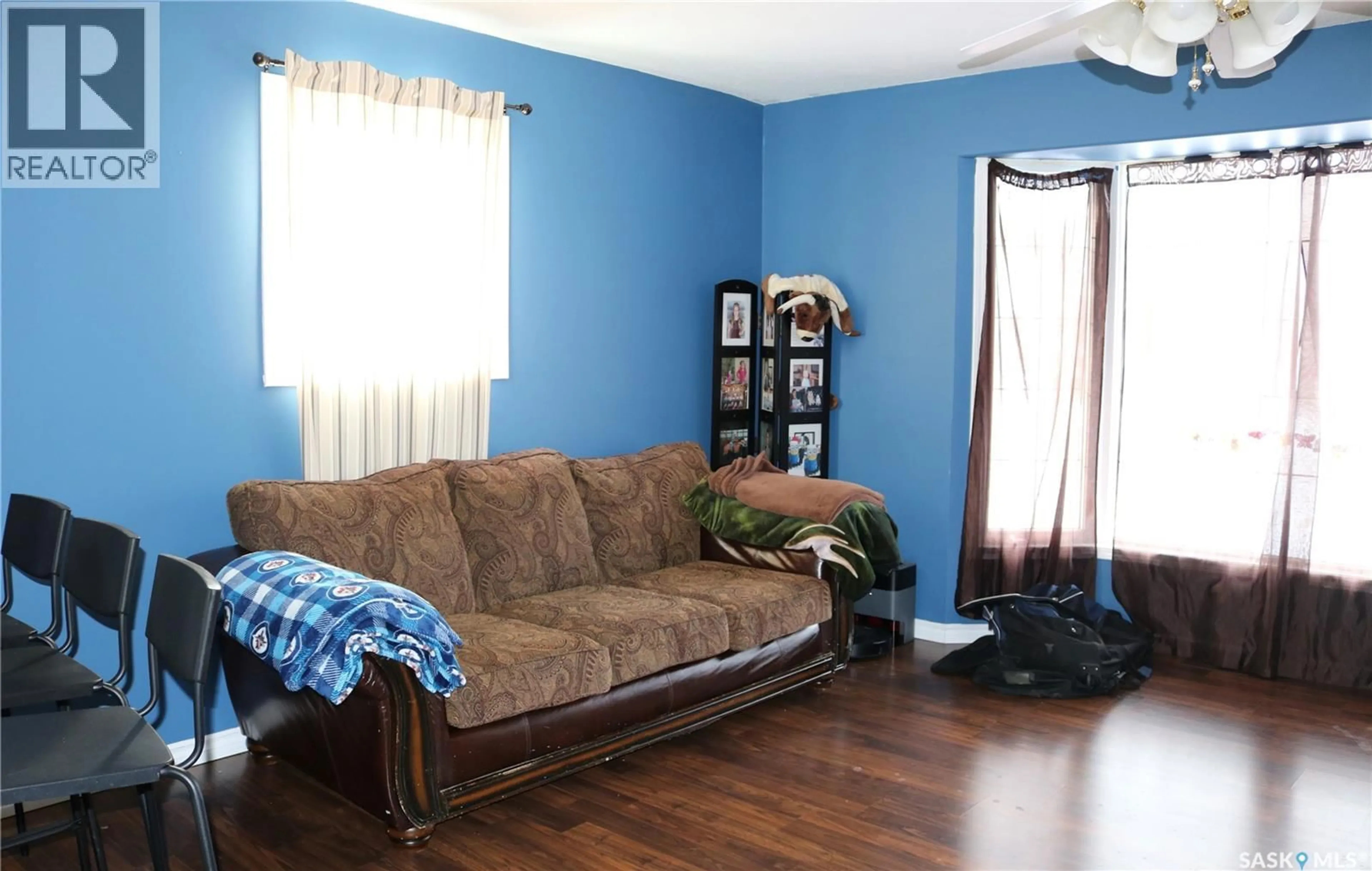 Living room with furniture, wood/laminate floor for 209 PELLY STREET, Rocanville Saskatchewan S0A3L0