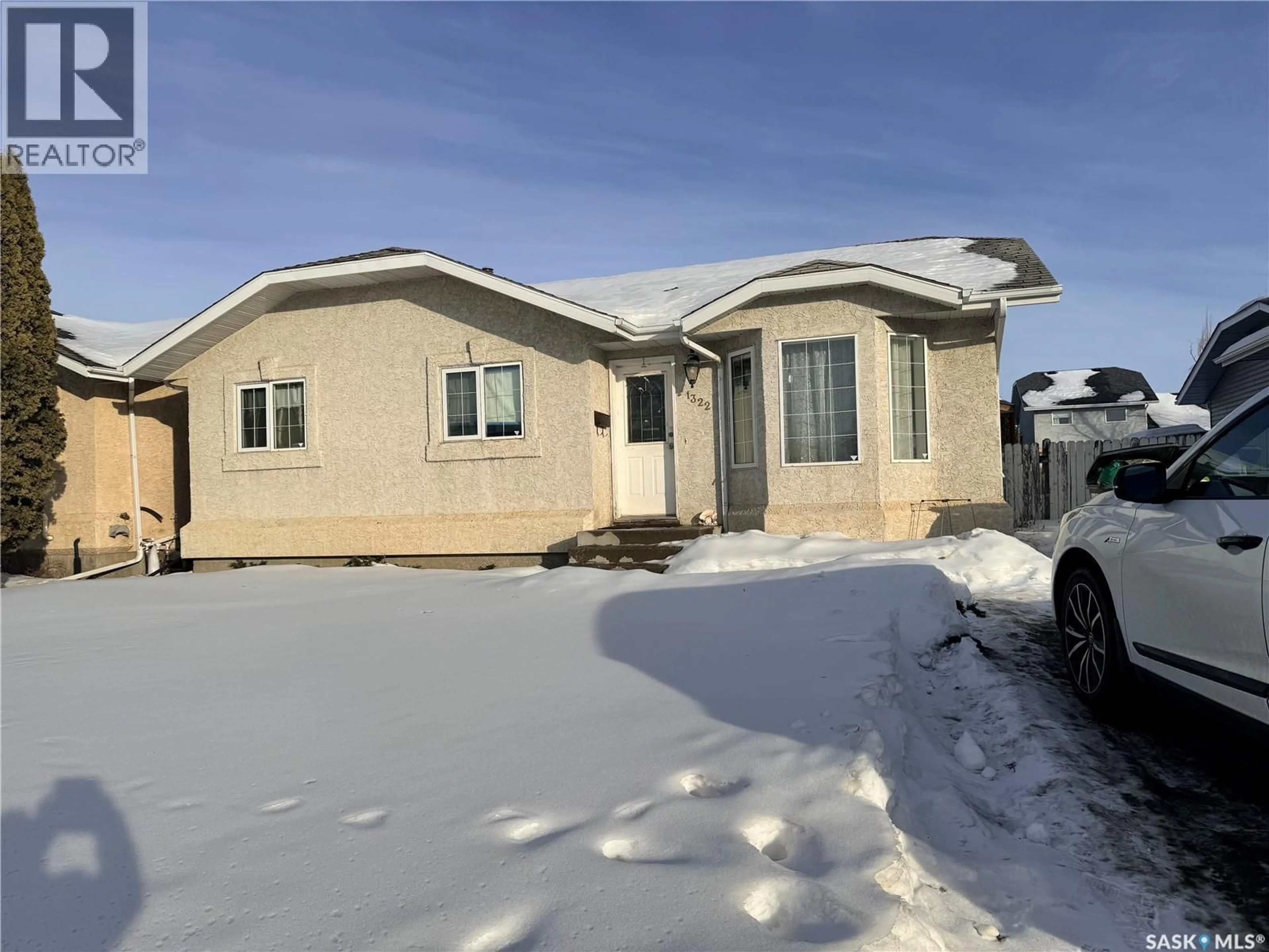 Home with vinyl exterior material, street for 1322 JUNOR AVENUE, Saskatoon Saskatchewan S7L7K1