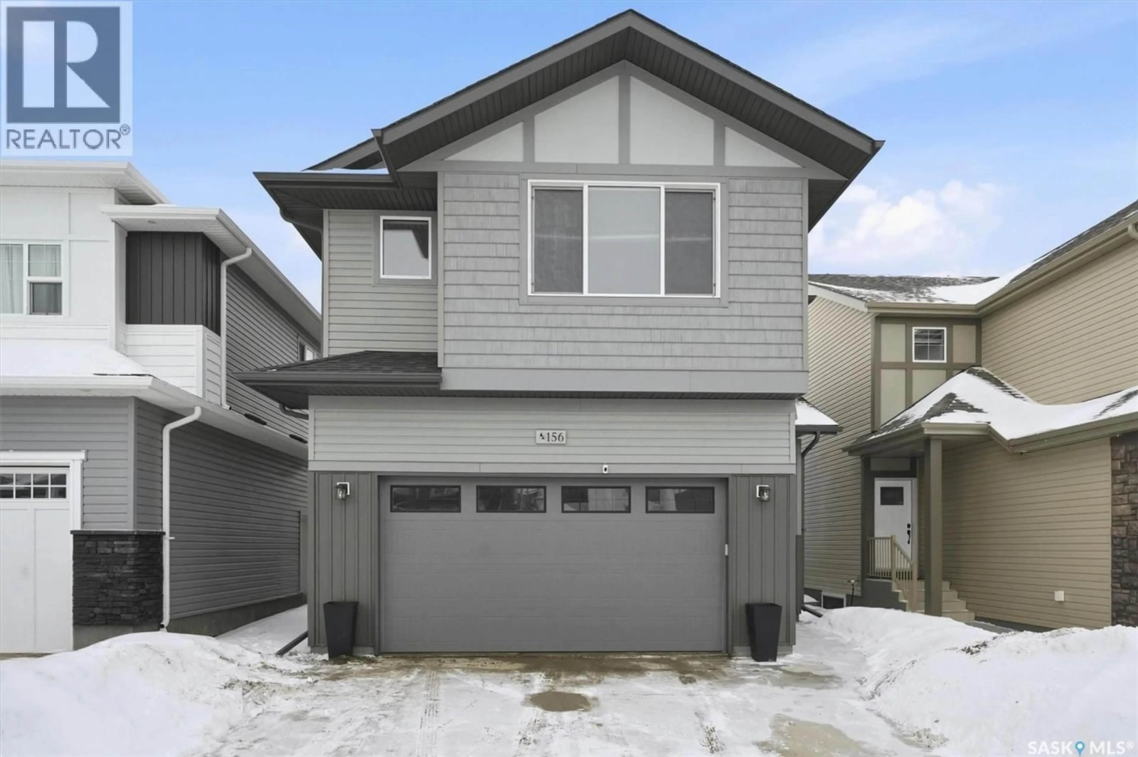 Home with vinyl exterior material, street for 156 THAKUR STREET, Saskatoon Saskatchewan S7W1C4