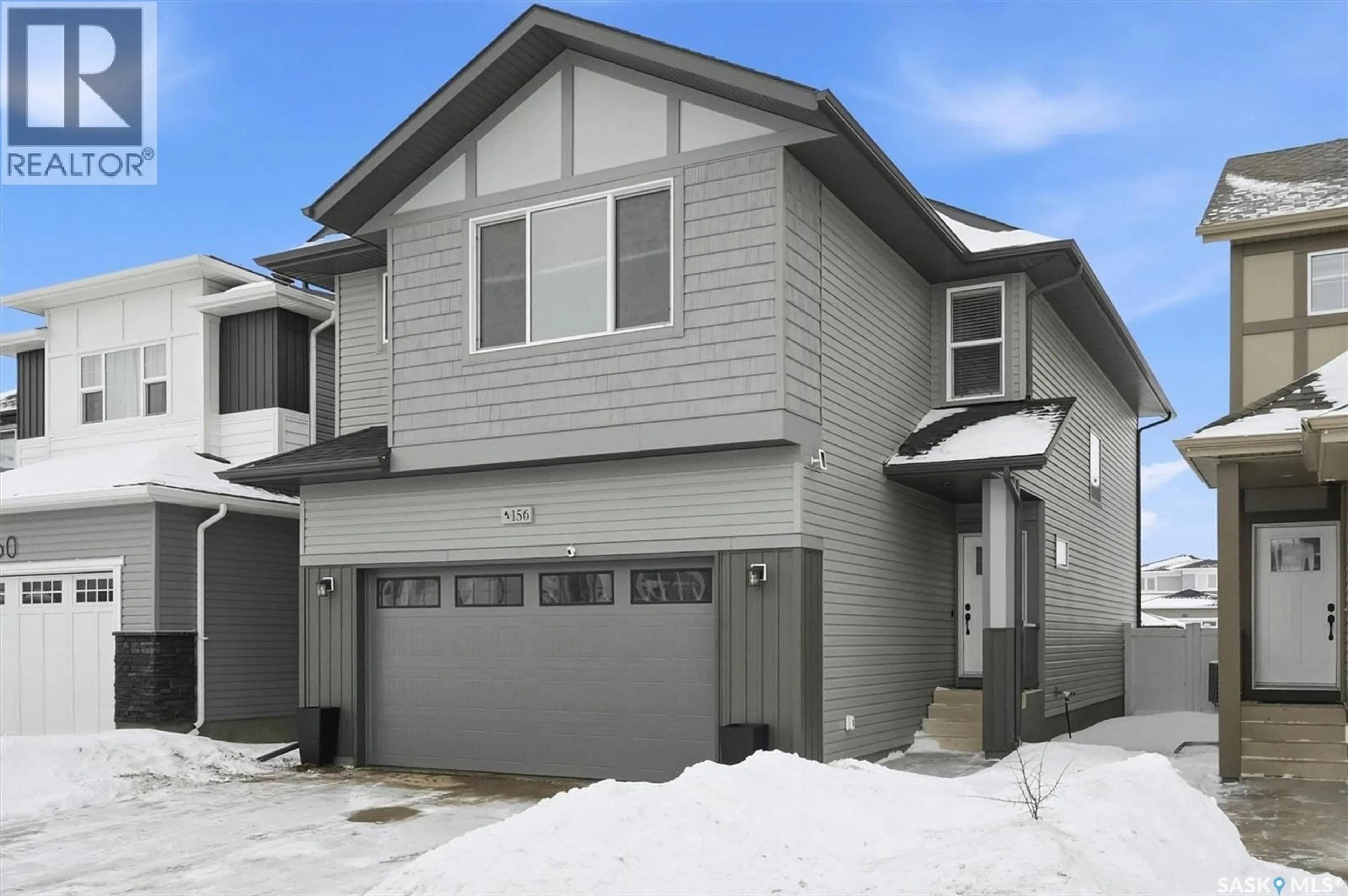 Home with vinyl exterior material, street for 156 THAKUR STREET, Saskatoon Saskatchewan S7W1C4