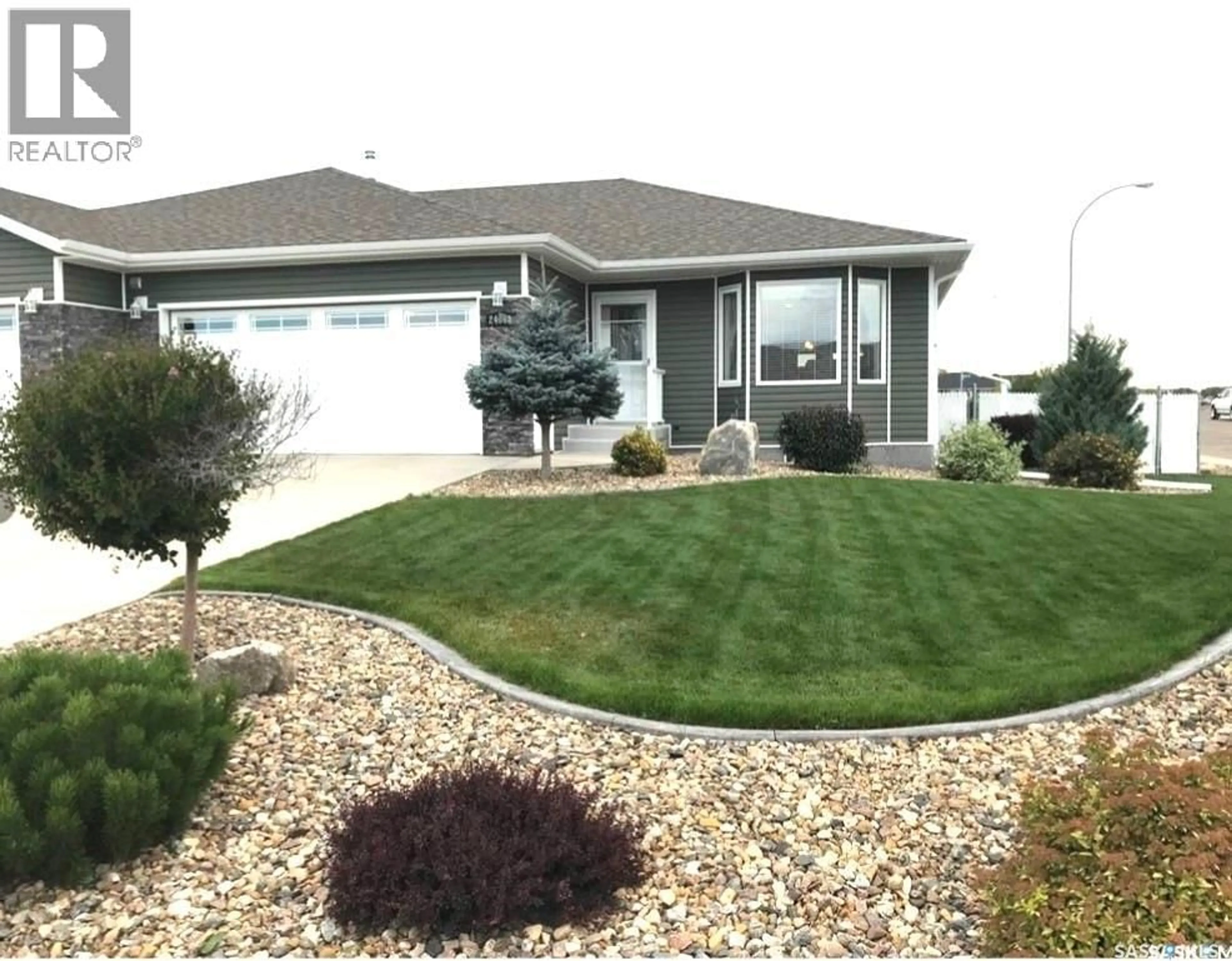 Home with vinyl exterior material, street for 2406A HENDERSON DRIVE, North Battleford Saskatchewan S9A3T5