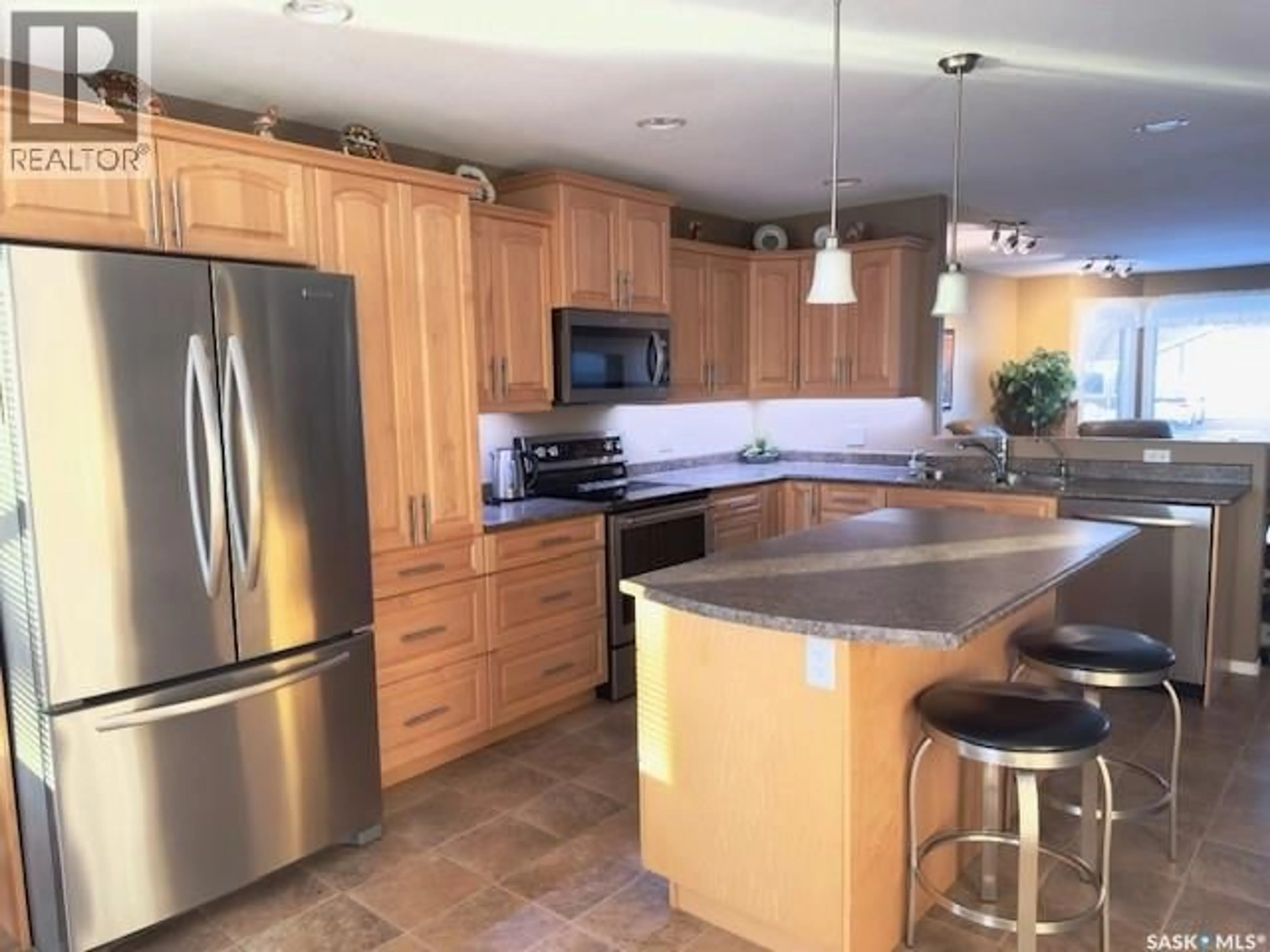 Open concept kitchen, ceramic/tile floor for 2406A HENDERSON DRIVE, North Battleford Saskatchewan S9A3T5