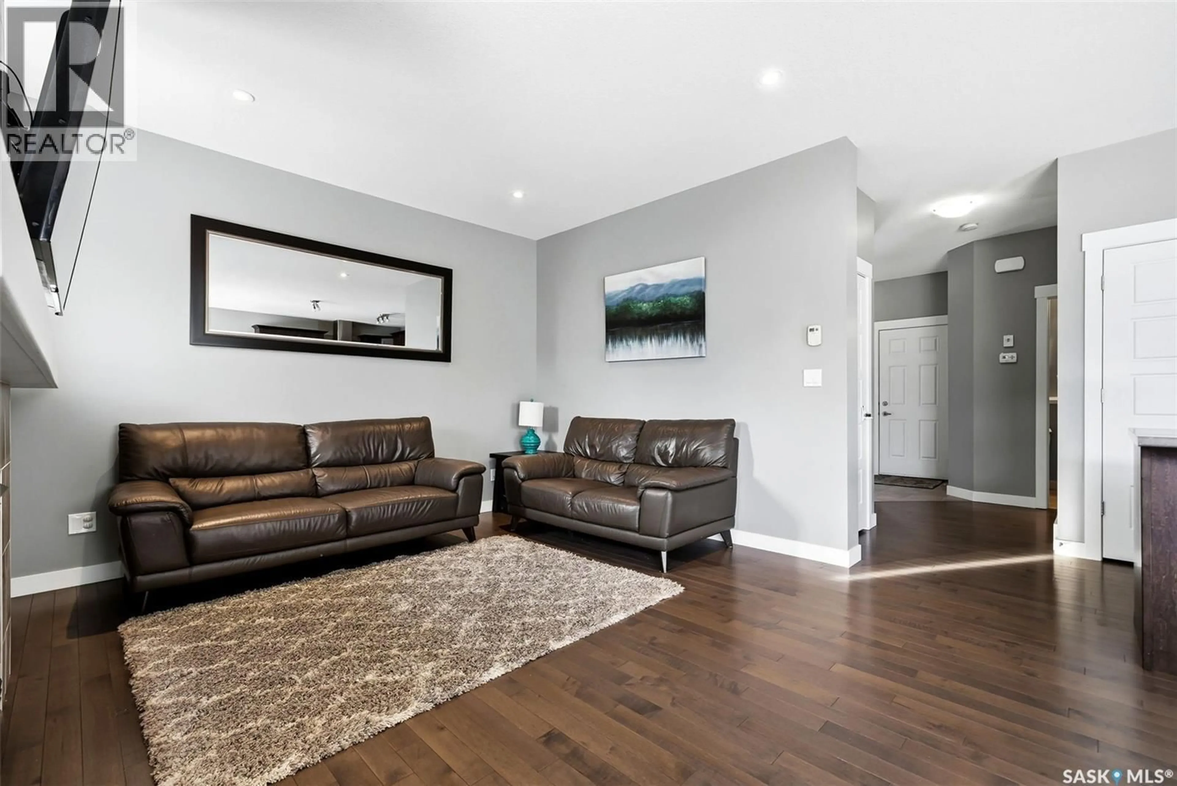 Living room with furniture, wood/laminate floor for 2813 ELGAARD DRIVE, Regina Saskatchewan S4R8J6