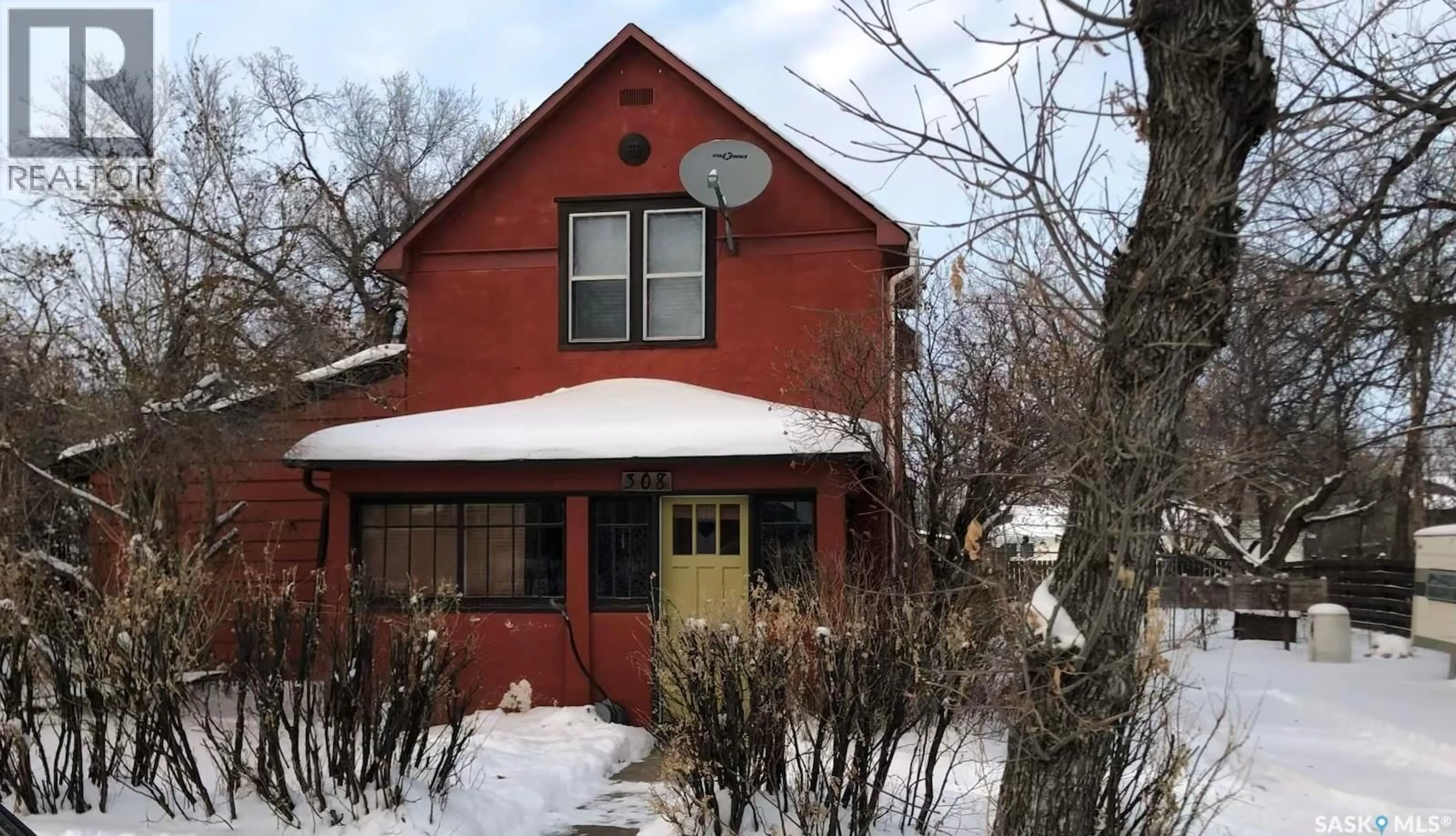 Home with brick exterior material, street for 308 5TH AVENUE, Assiniboia Saskatchewan S0H0B0