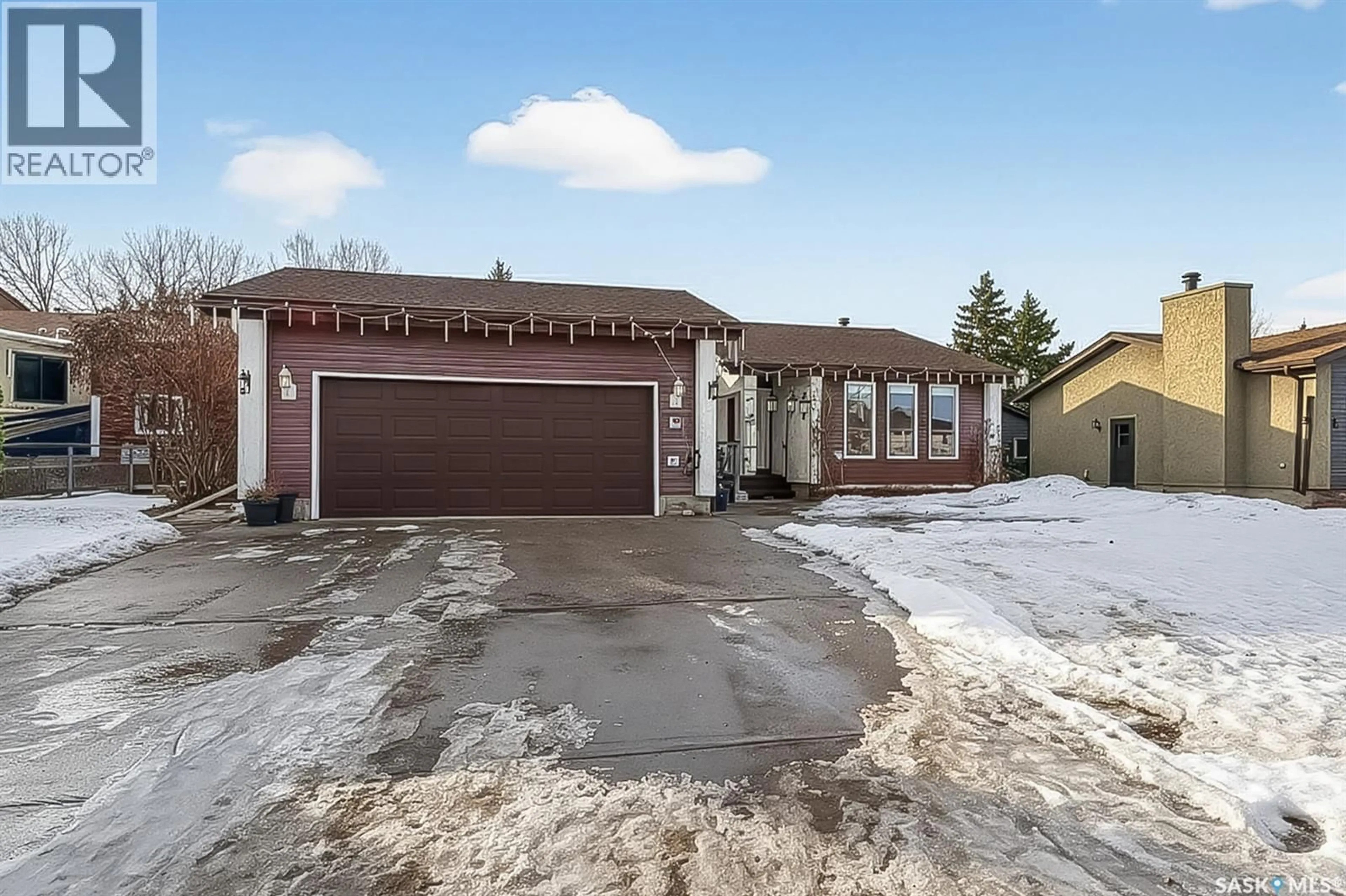 Home with brick exterior material, street for 70 WOOD LILY DRIVE, Moose Jaw Saskatchewan S6J1E2