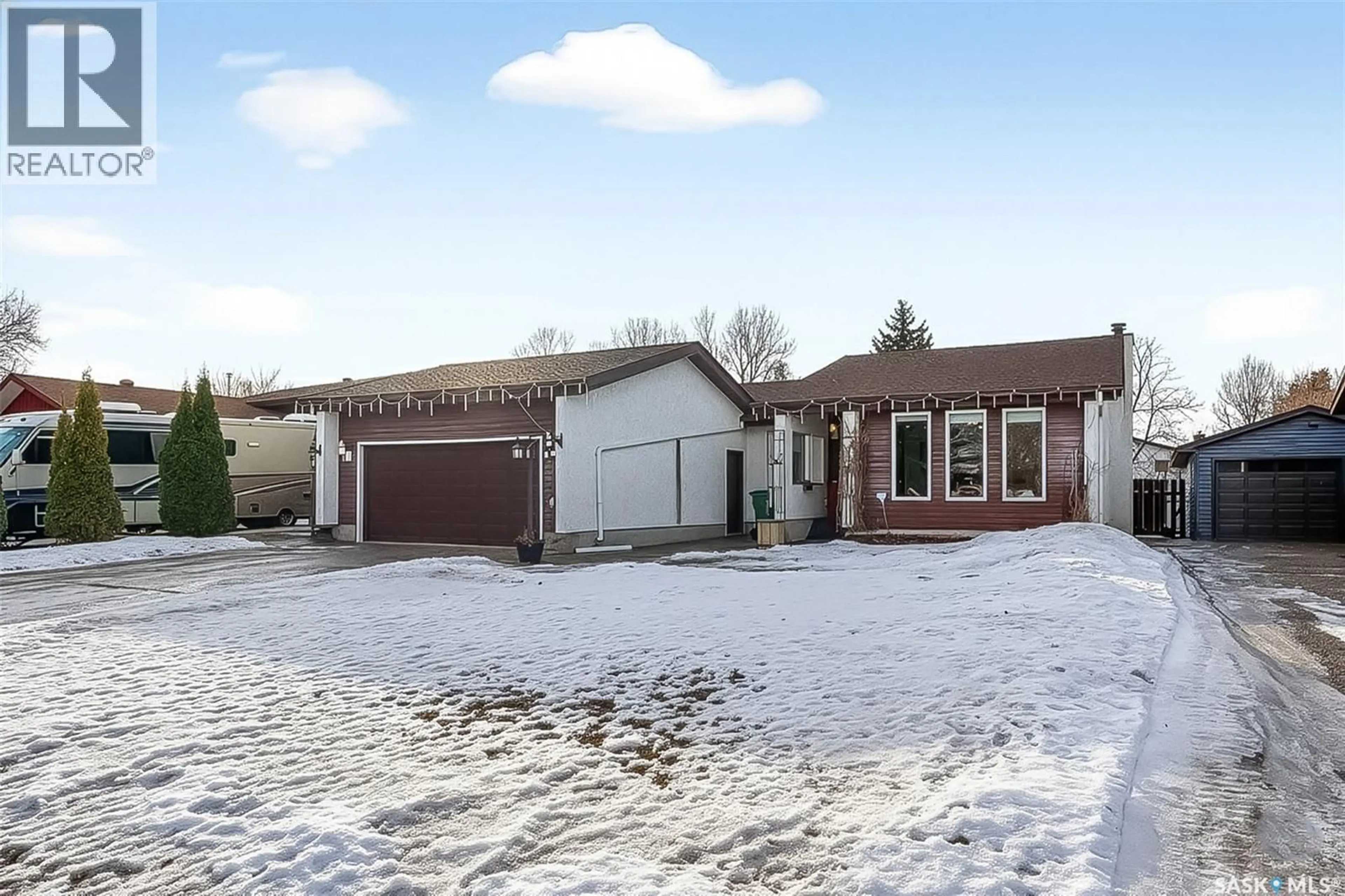 Home with brick exterior material, street for 70 WOOD LILY DRIVE, Moose Jaw Saskatchewan S6J1E2