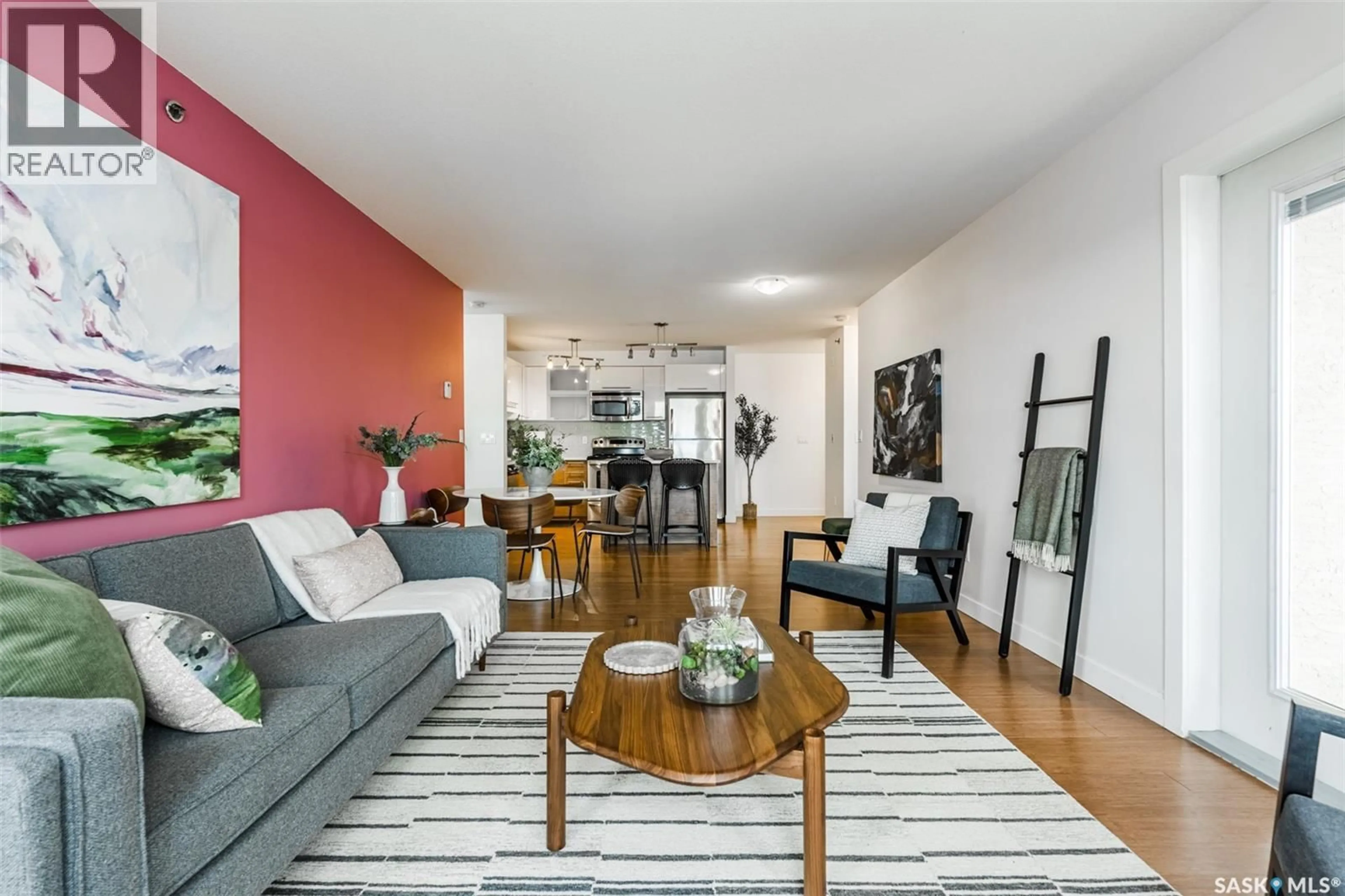 Living room with furniture, wood/laminate floor for 304B HUNTER ROAD, Saskatoon Saskatchewan S7T0J8