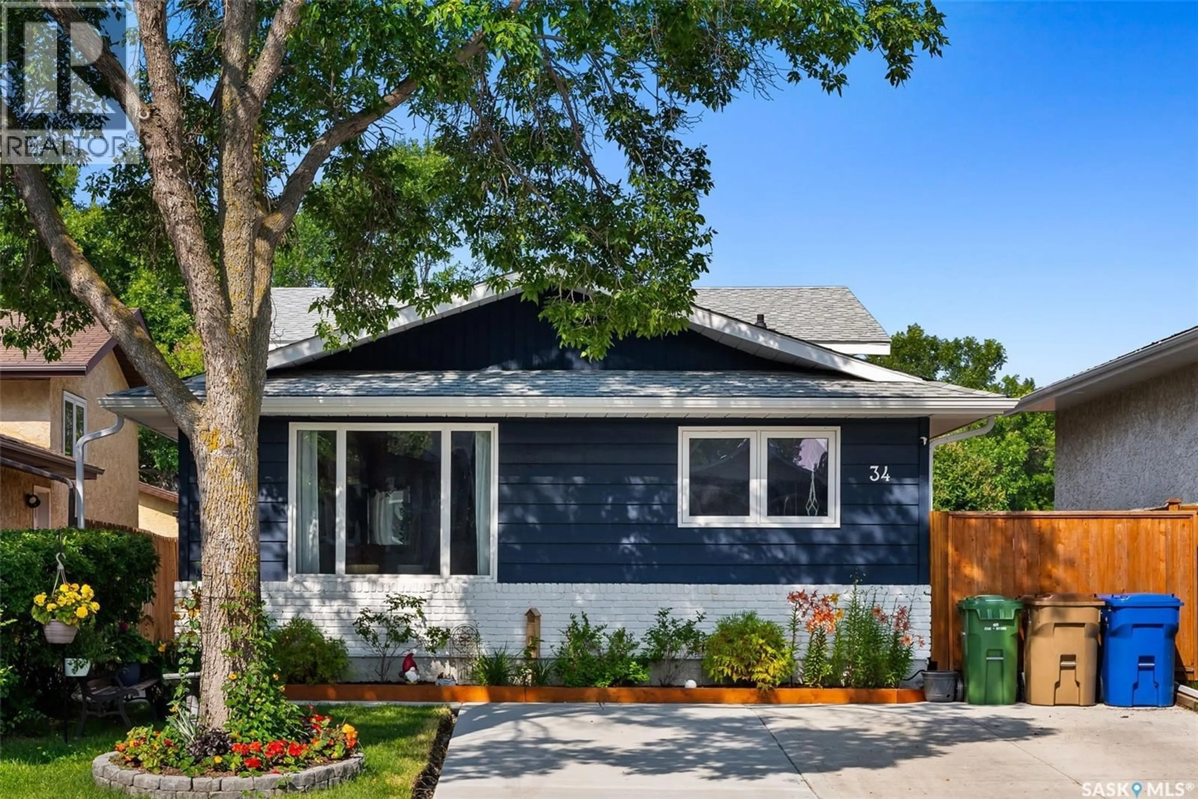 Home with vinyl exterior material, street for 34 CARTER CRESCENT, Regina Saskatchewan S4X2C7