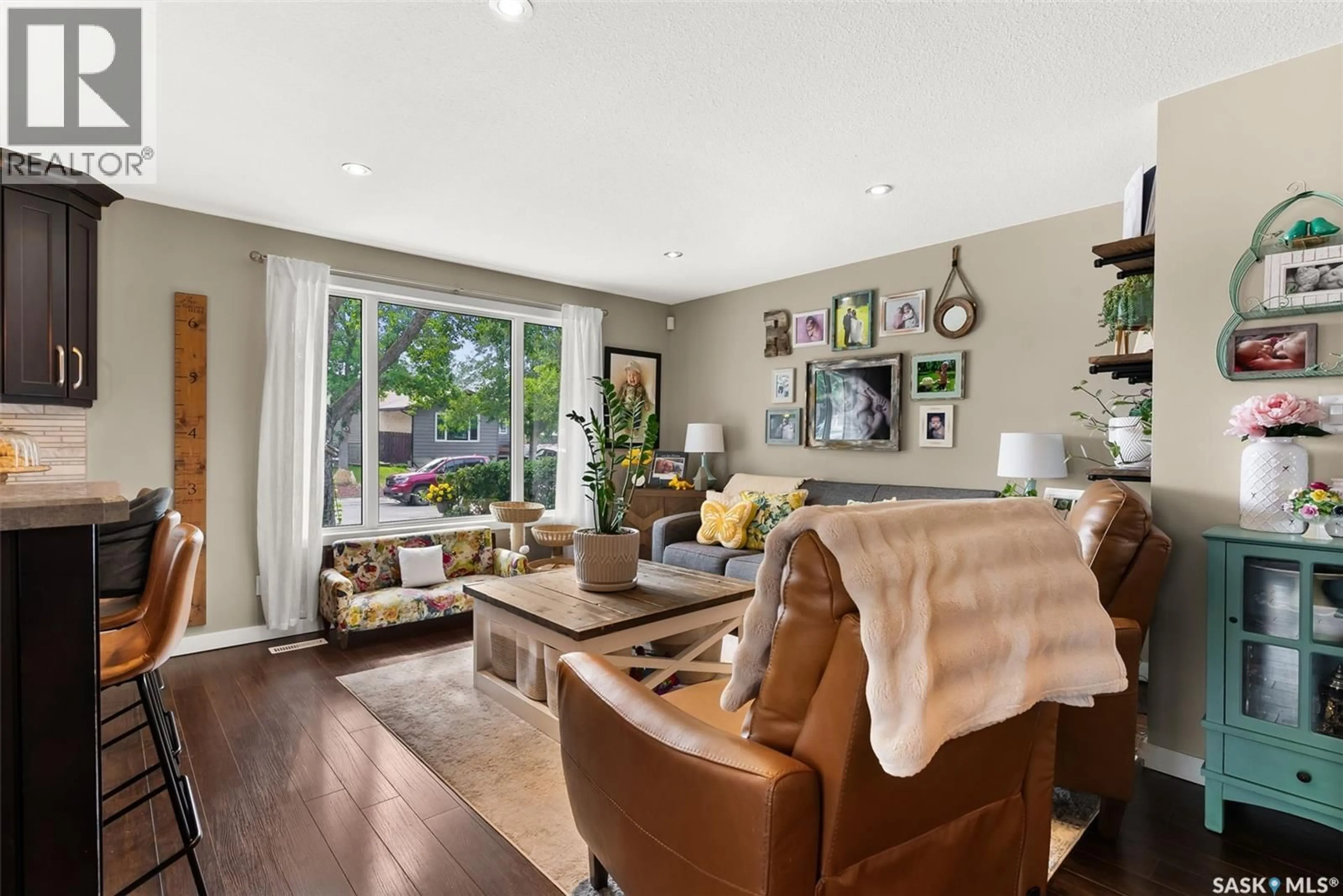 Living room with furniture, wood/laminate floor for 34 CARTER CRESCENT, Regina Saskatchewan S4X2C7