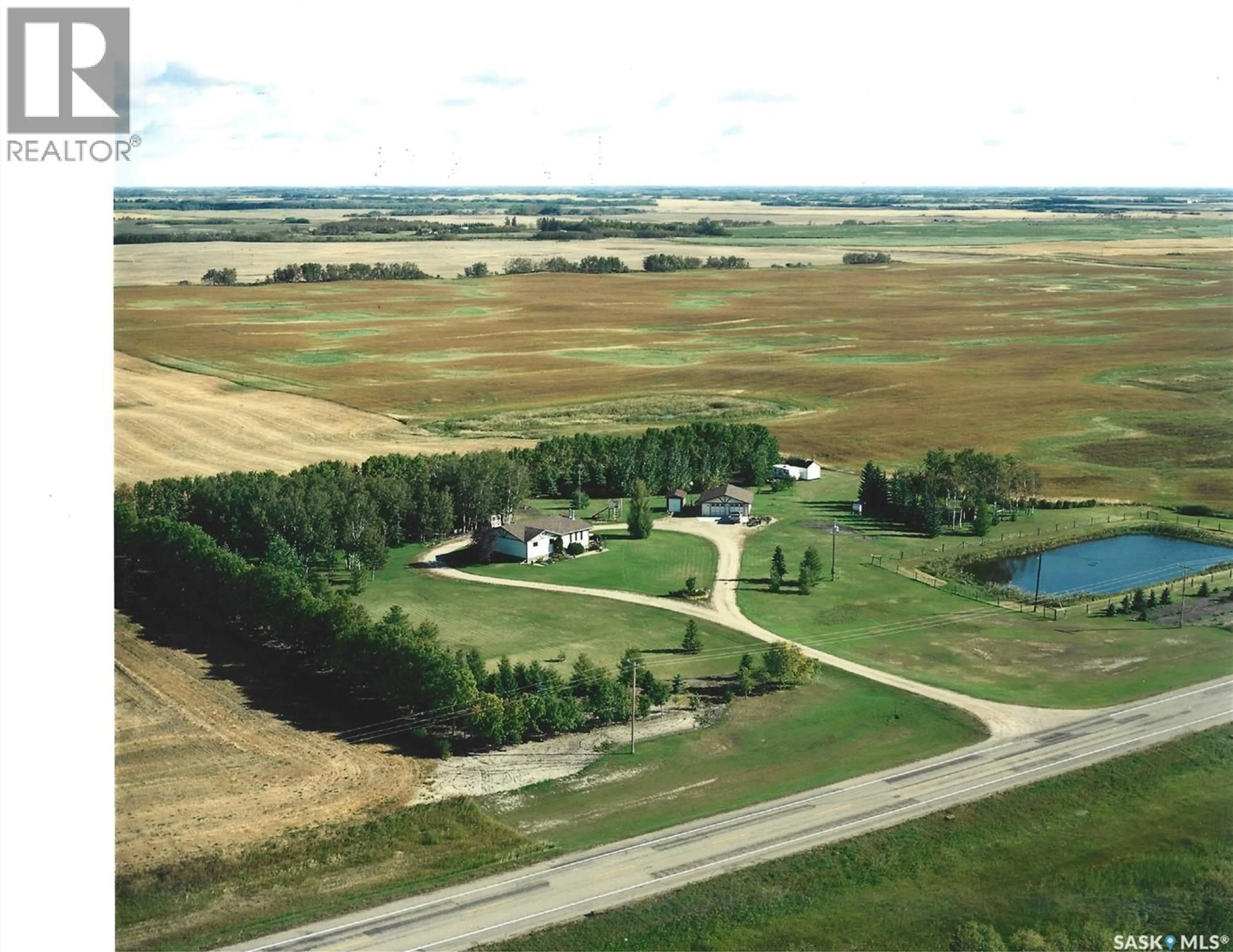 A pic from outside/outdoor area/front of a property/back of a property/a pic from drone, water/lake/river/ocean view for KREKLEWICH ACREAGE, Melville Saskatchewan S0A2P0