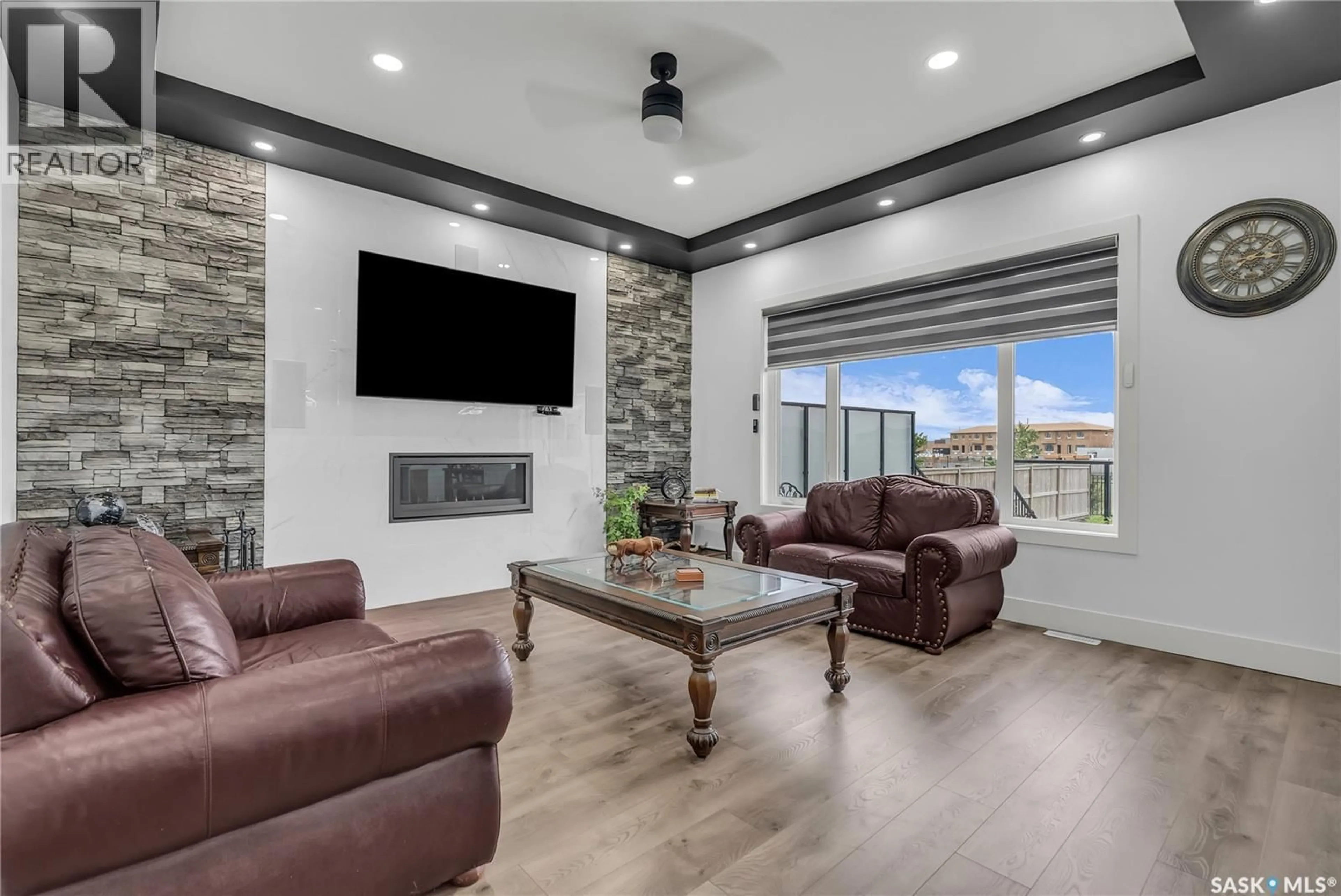 Living room with furniture, ceramic/tile floor for 144 FORSEY AVENUE, Saskatoon Saskatchewan S7W0Z6