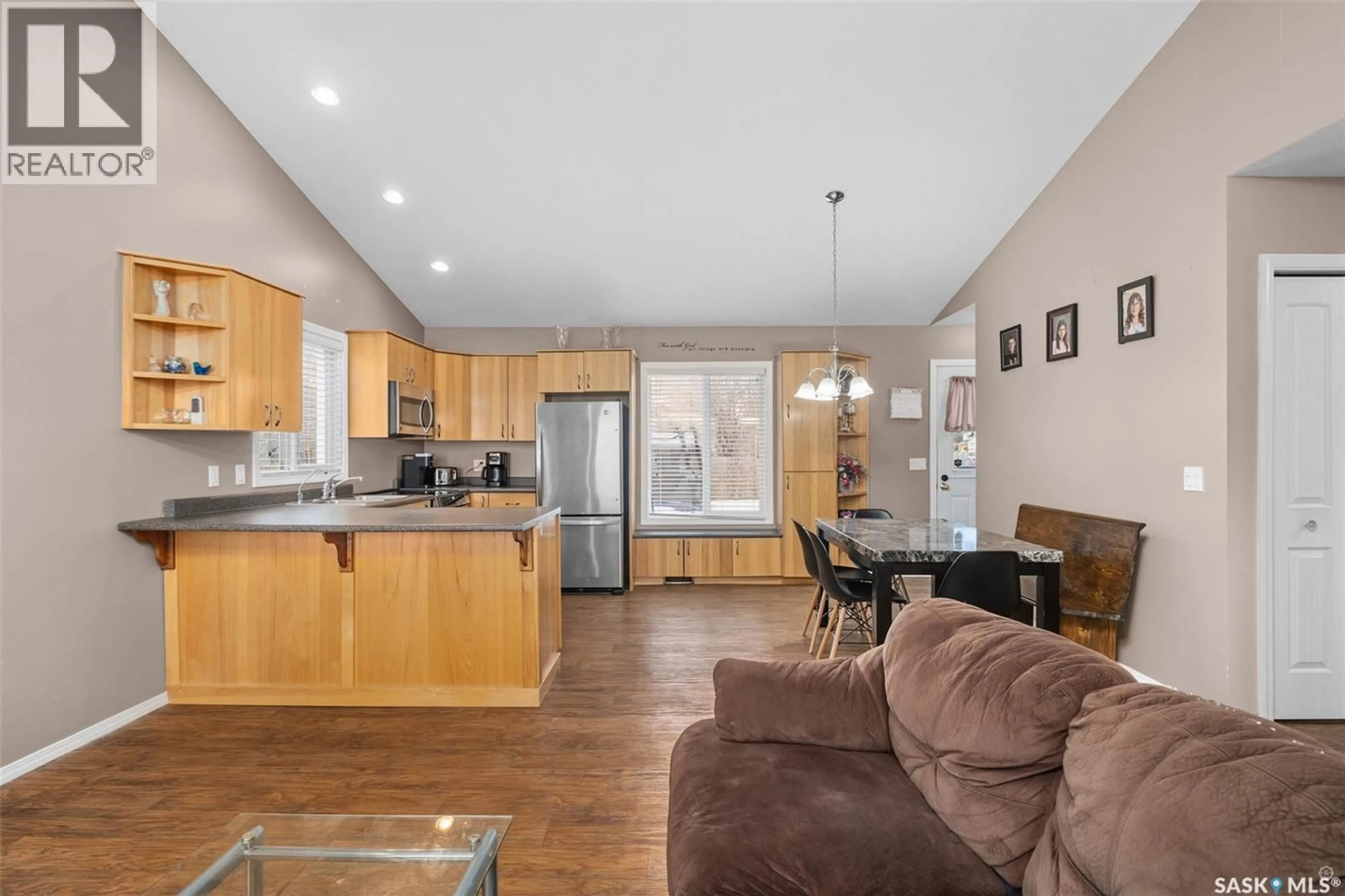 Open concept kitchen, wood/laminate floor for 335 RUTTLE AVENUE, Kinistino Saskatchewan S0J1H0