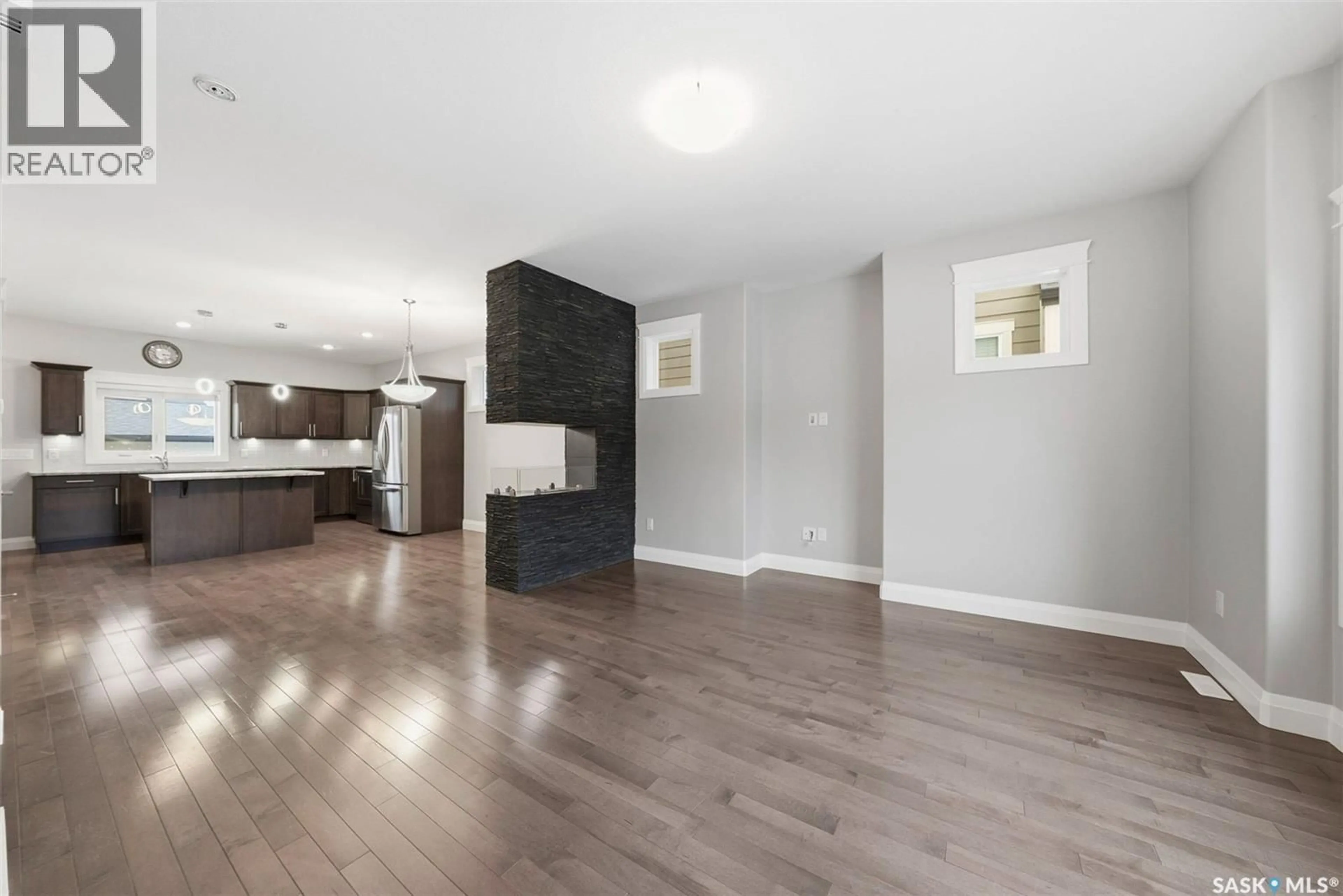 Open concept kitchen, wood/laminate floor for N - 10 111 ROSEWOOD GATE, Saskatoon Saskatchewan S7V0E5