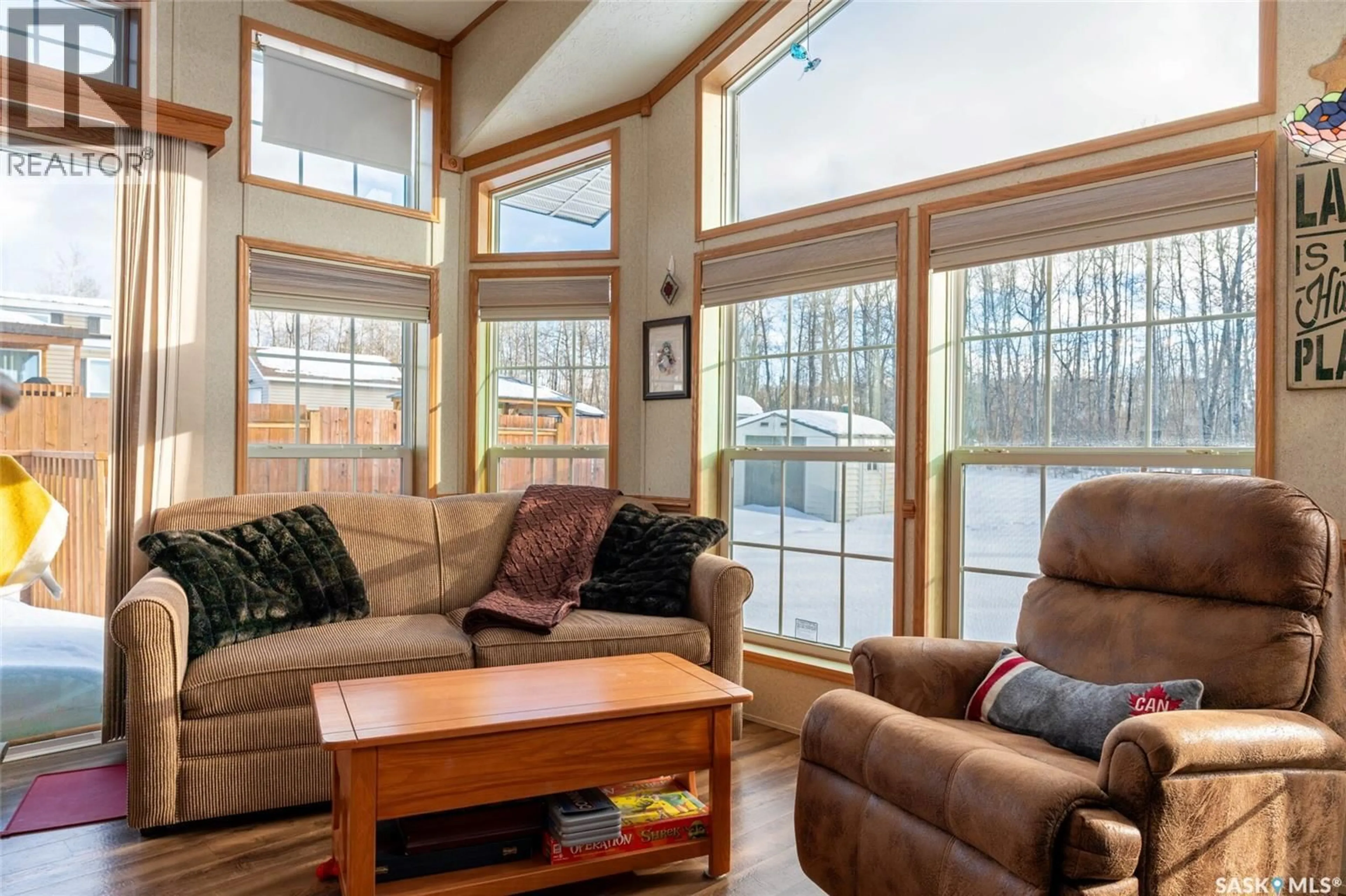 Living room with furniture, wood/laminate floor for 1209 OAK AVENUE, Beaver River Rm No. 622 Saskatchewan S0M1A0