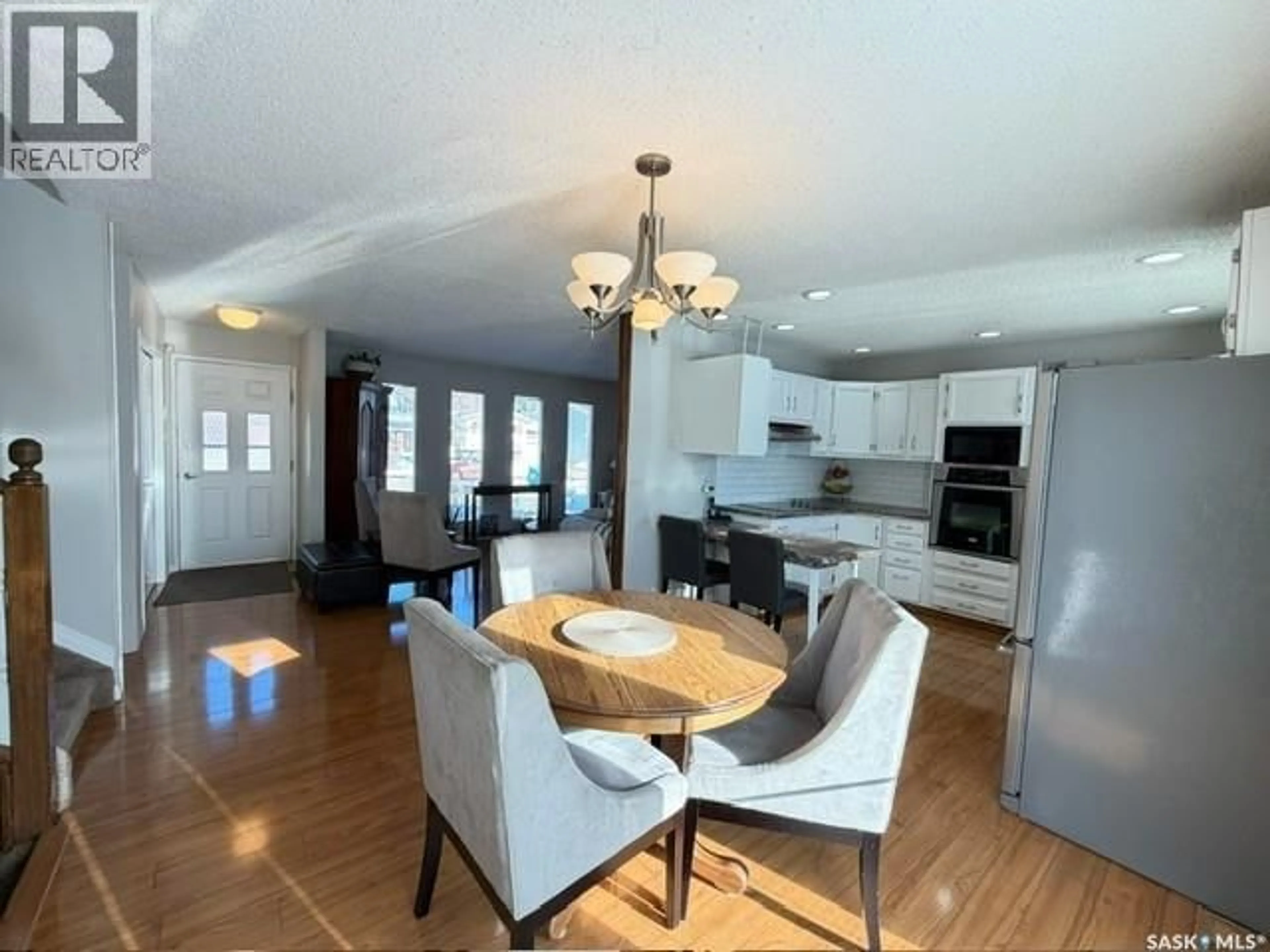 Open concept kitchen, wood/laminate floor for 10 DRAGAN CRESCENT, Saskatoon Saskatchewan S7H5C9