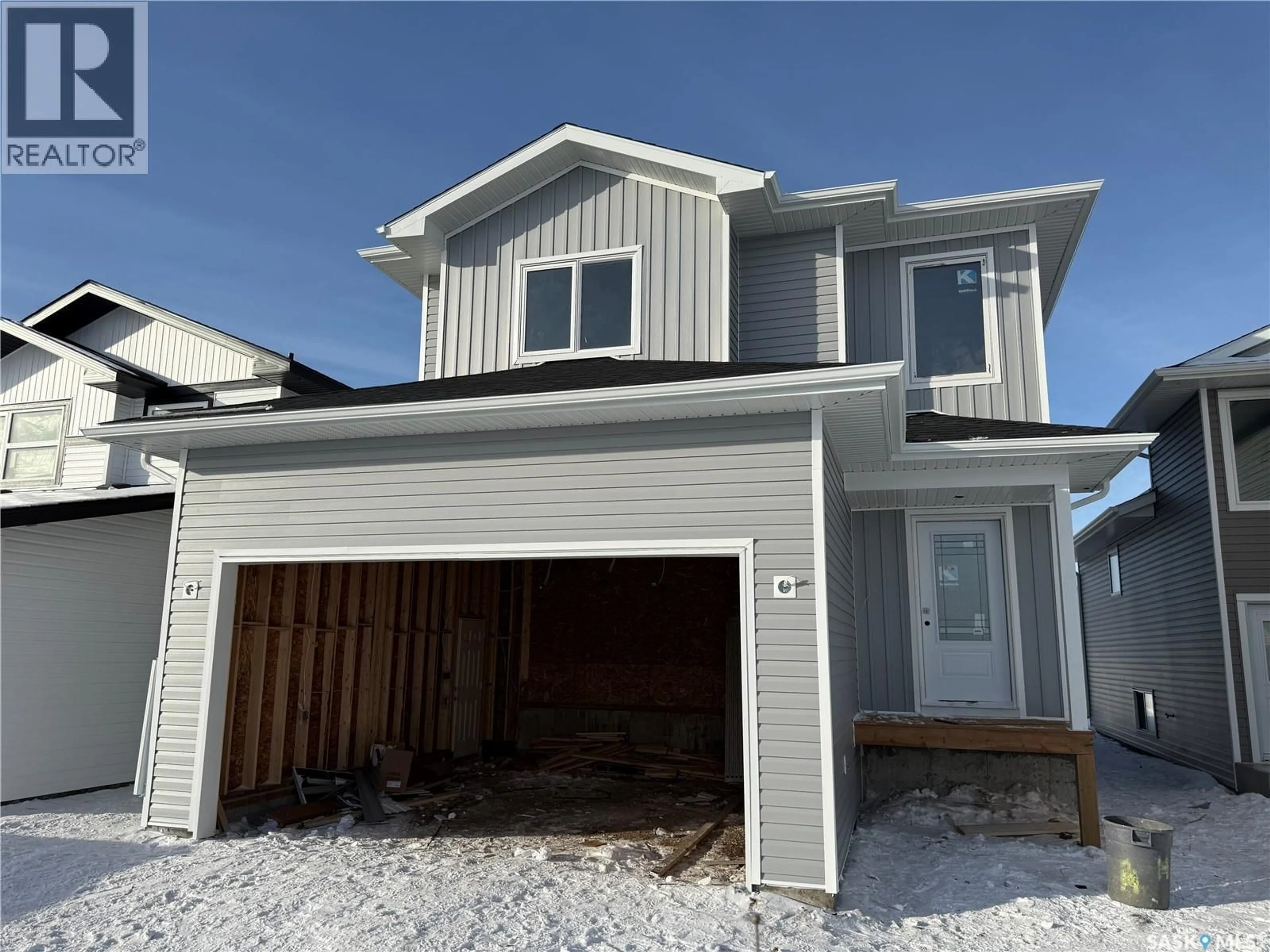 Home with vinyl exterior material, street for 235 FROESE CRESCENT, Warman Saskatchewan S0K4S0