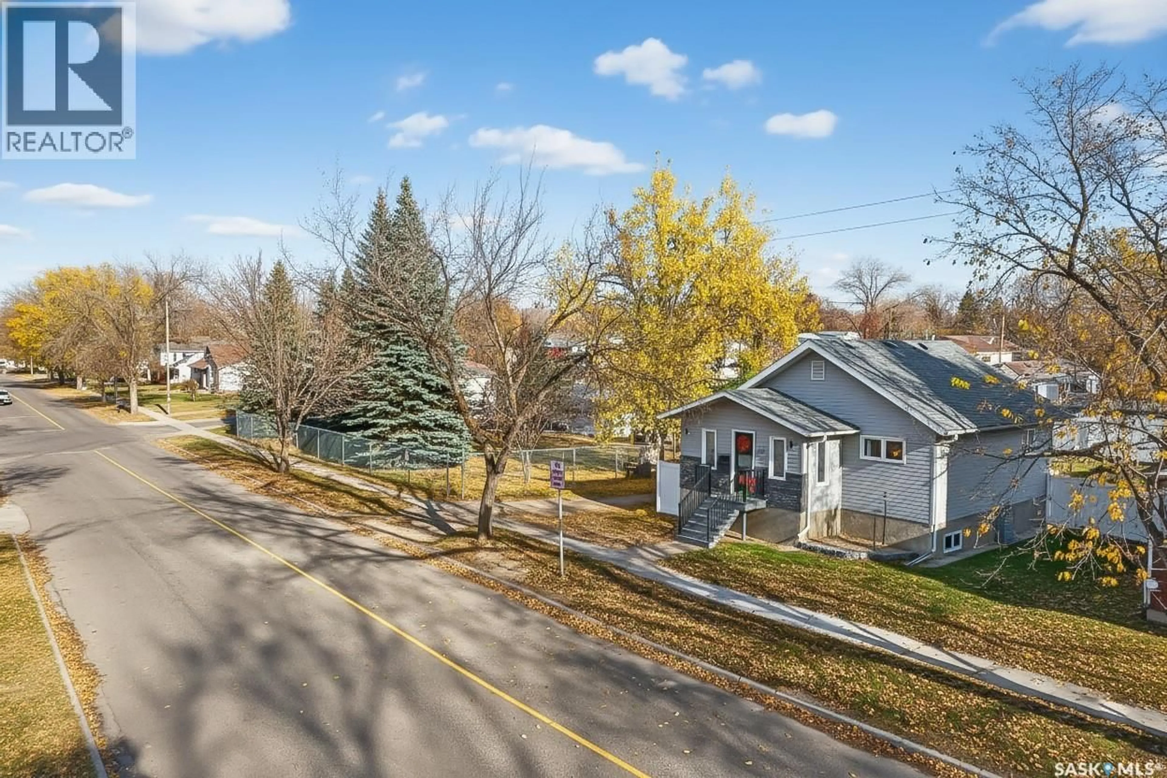 A pic from outside/outdoor area/front of a property/back of a property/a pic from drone, street for 1151 1ST AVENUE, Moose Jaw Saskatchewan S6H3N4