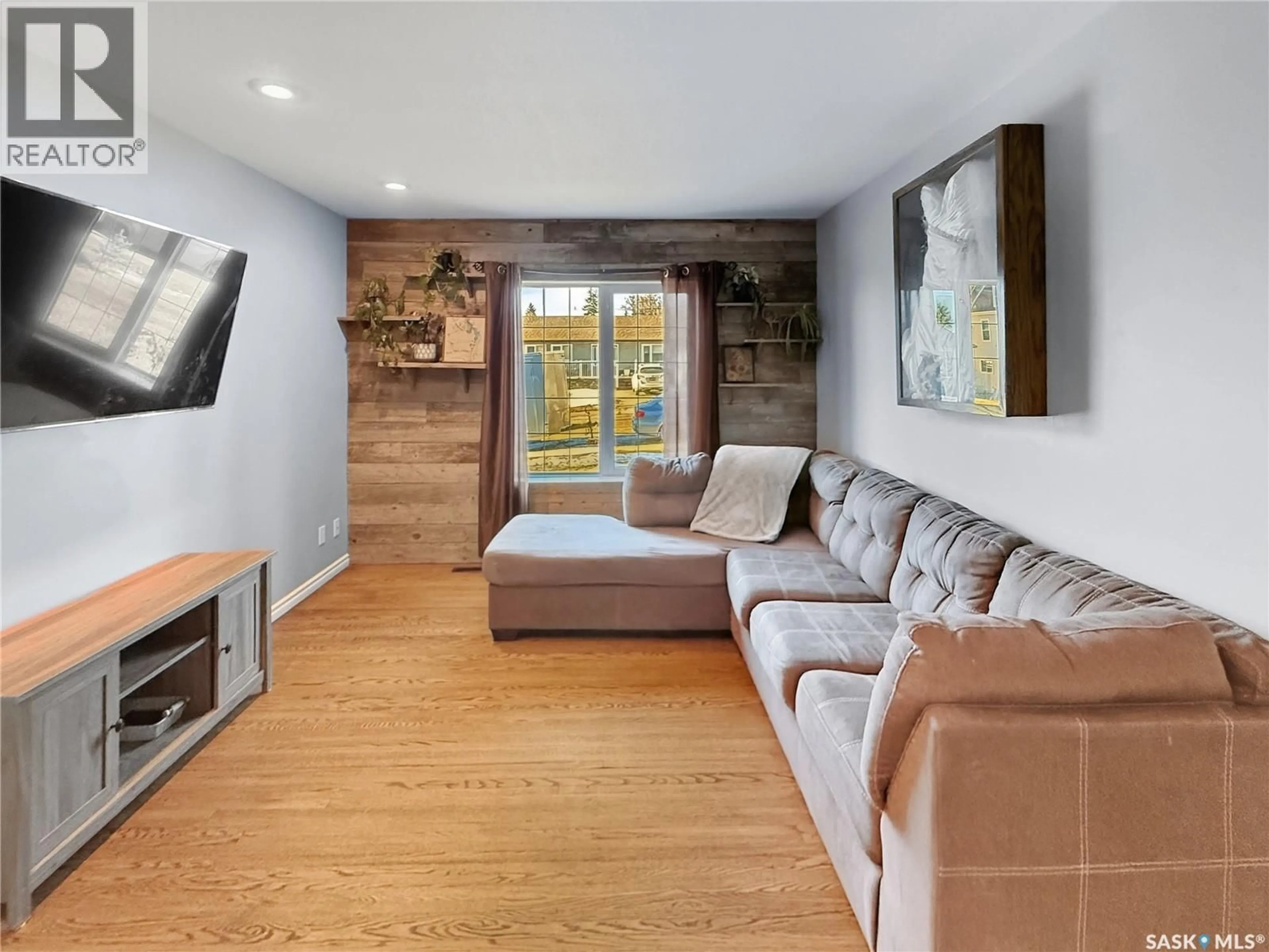 Living room with furniture, wood/laminate floor for 545 1ST AVENUE, Swift Current Saskatchewan S9H2B8