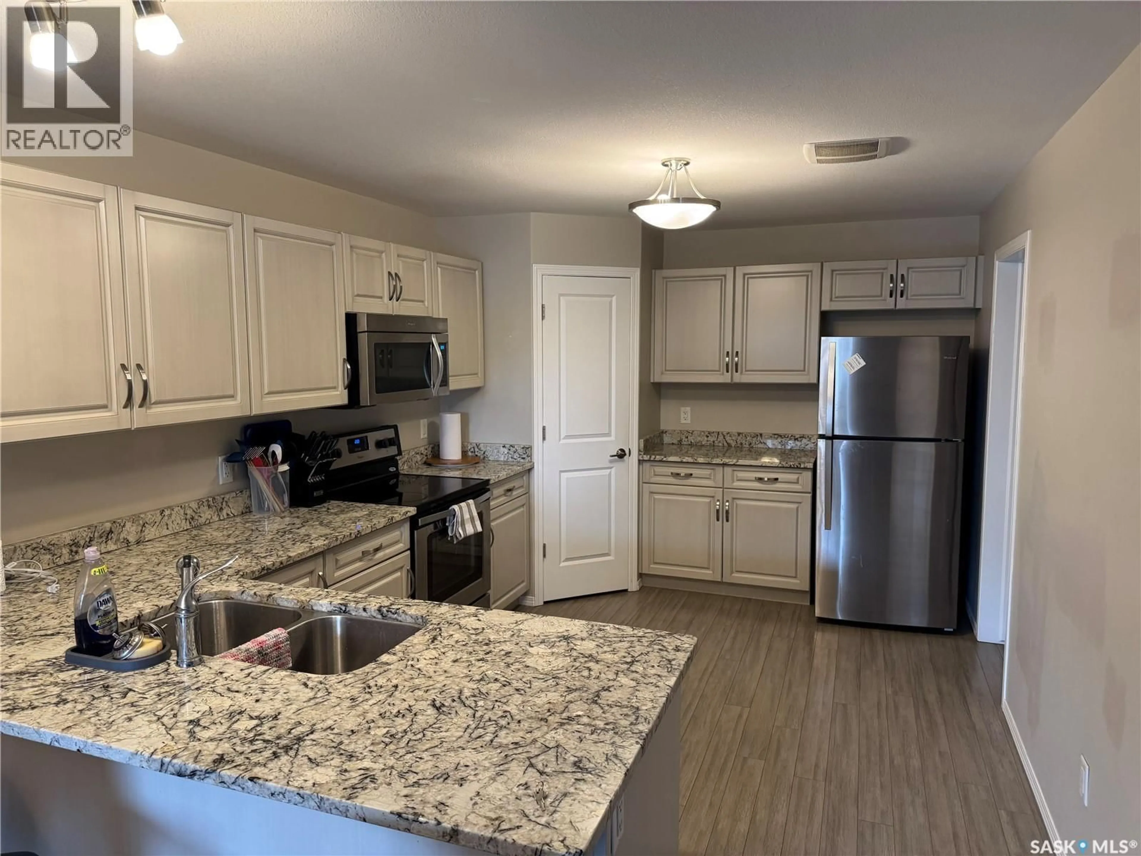 Open concept kitchen, ceramic/tile floor for 209 100 CHAPARRAL BOULEVARD, Martensville Saskatchewan S0K0A2