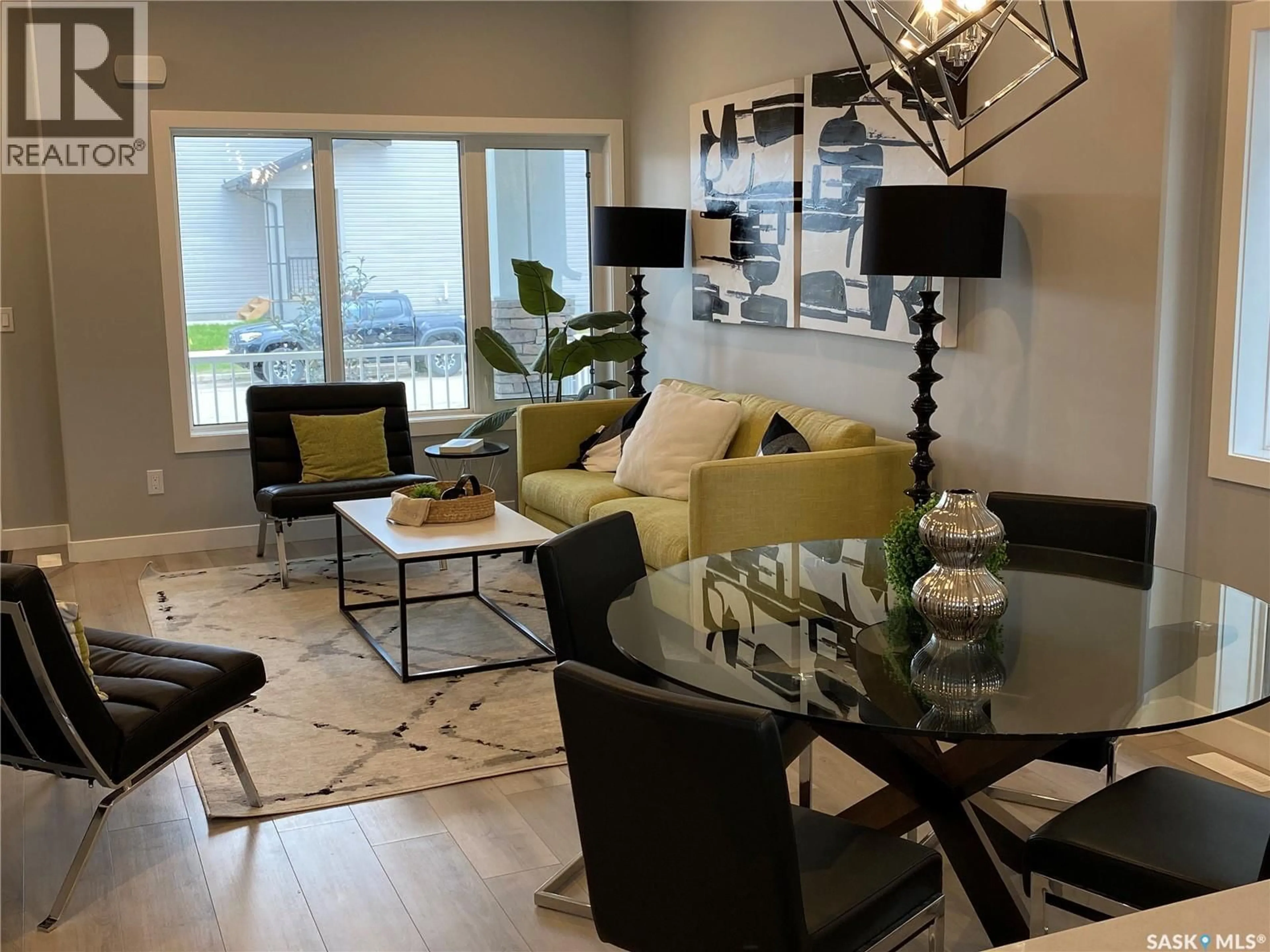 Living room with furniture, wood/laminate floor for 350 COWESSESS ROAD, Saskatoon Saskatchewan S7V1Y4