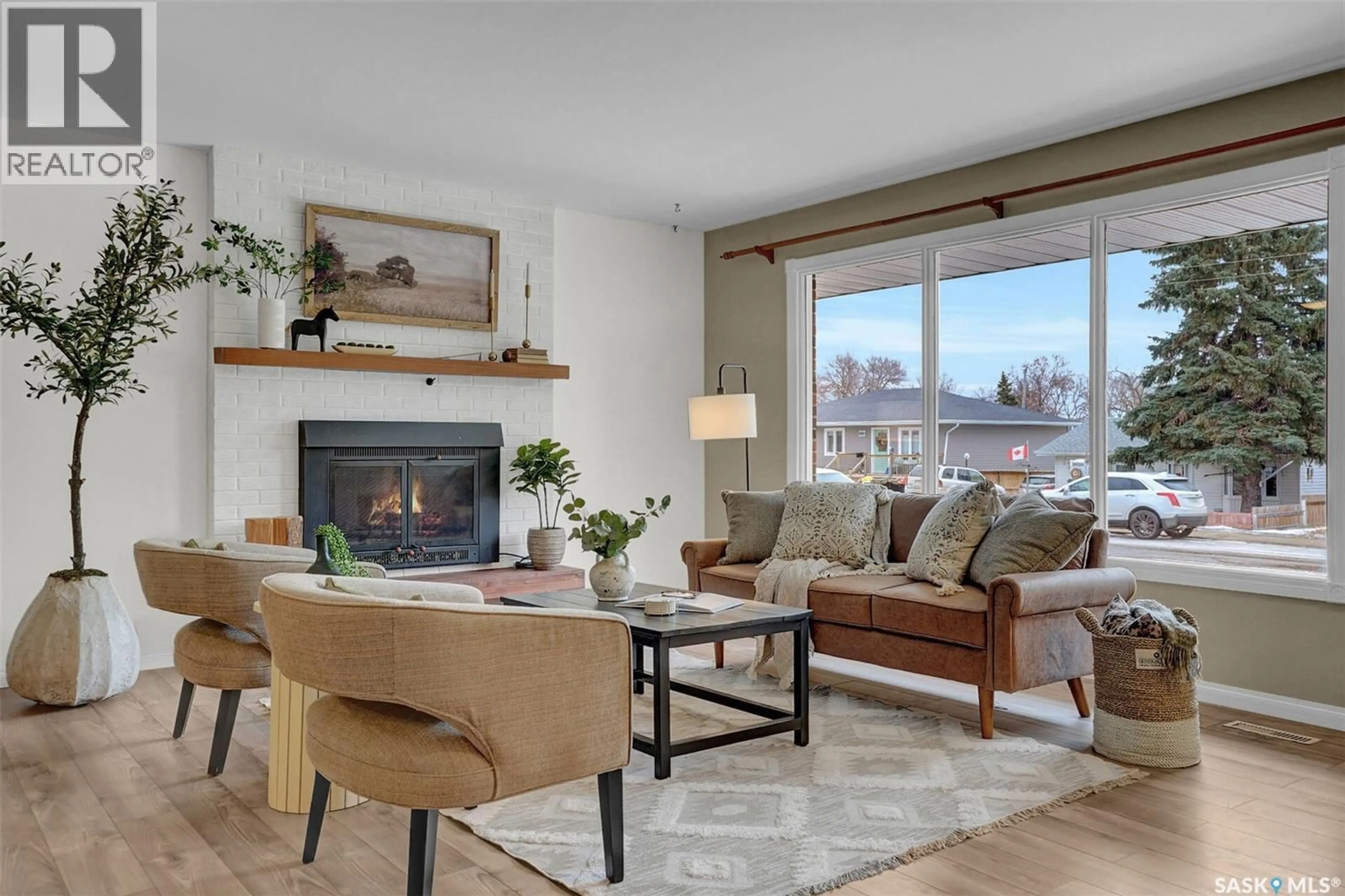 Living room with furniture, wood/laminate floor for 1024 MONTGOMERY STREET, Moose Jaw Saskatchewan S6H2X1