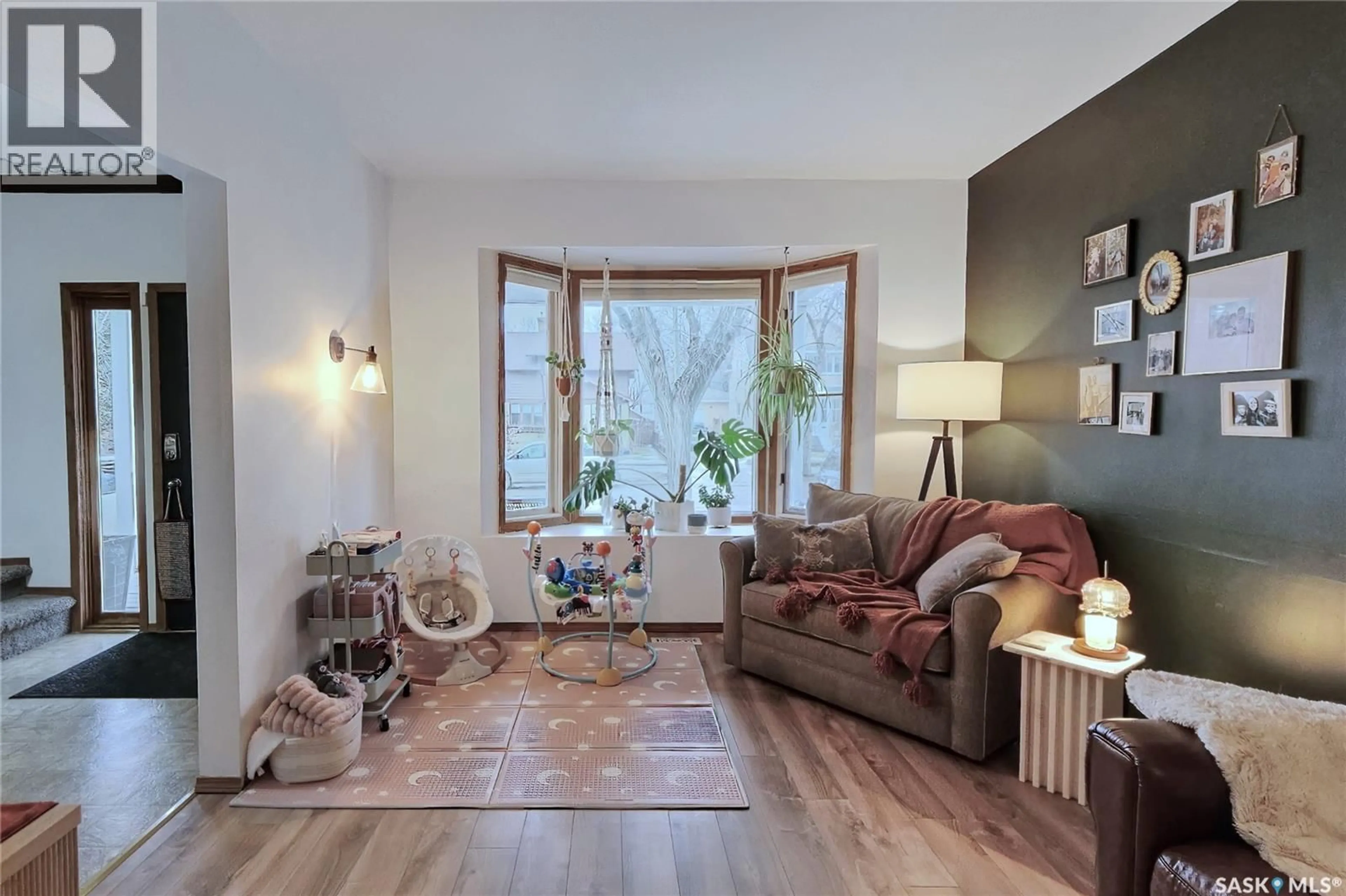 Living room with furniture, wood/laminate floor for 1135 2ND AVENUE, Moose Jaw Saskatchewan S6H3R4