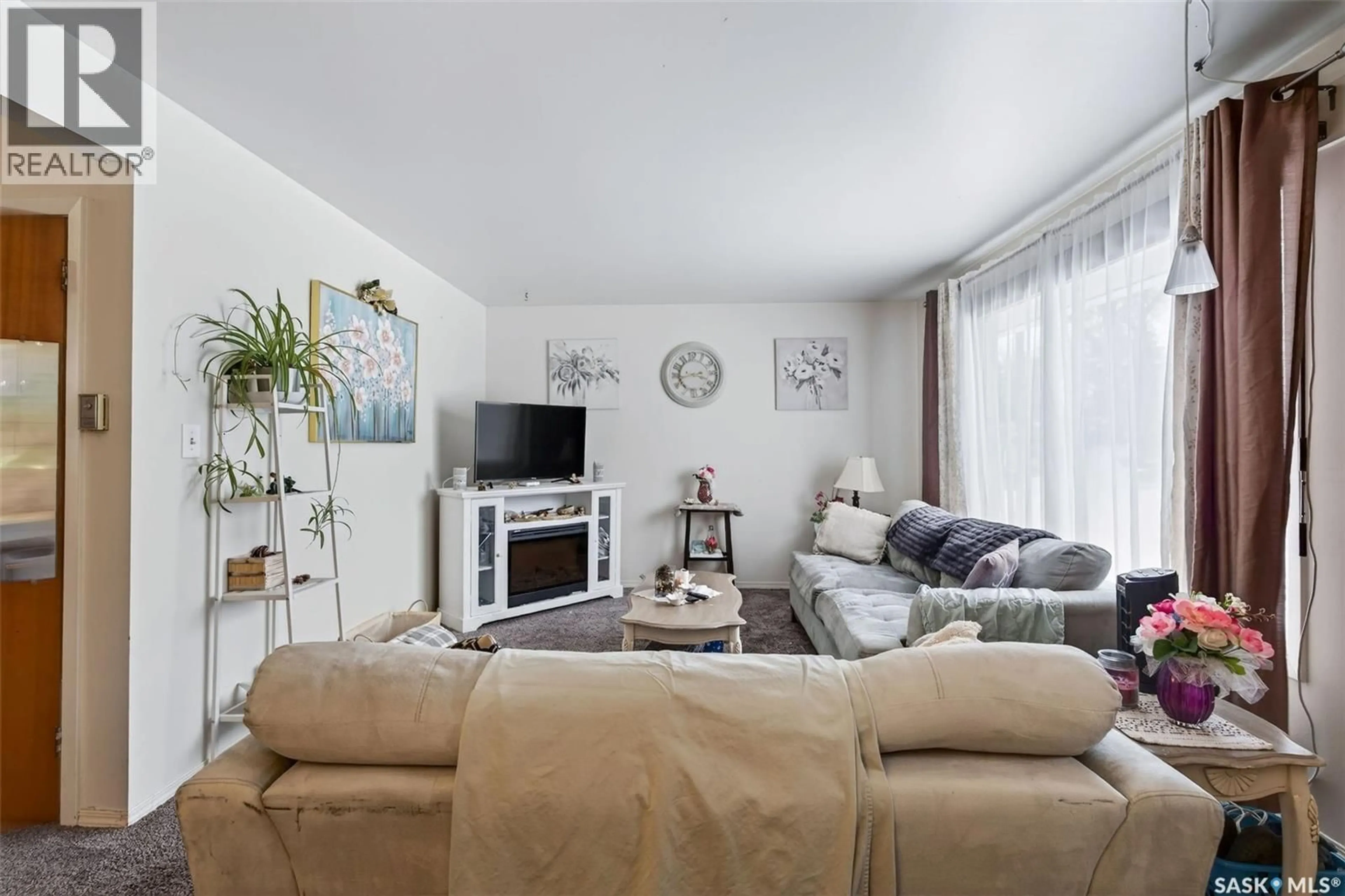 Living room with furniture, unknown for 214 HIGGINS AVENUE, Melfort Saskatchewan S0E1A0