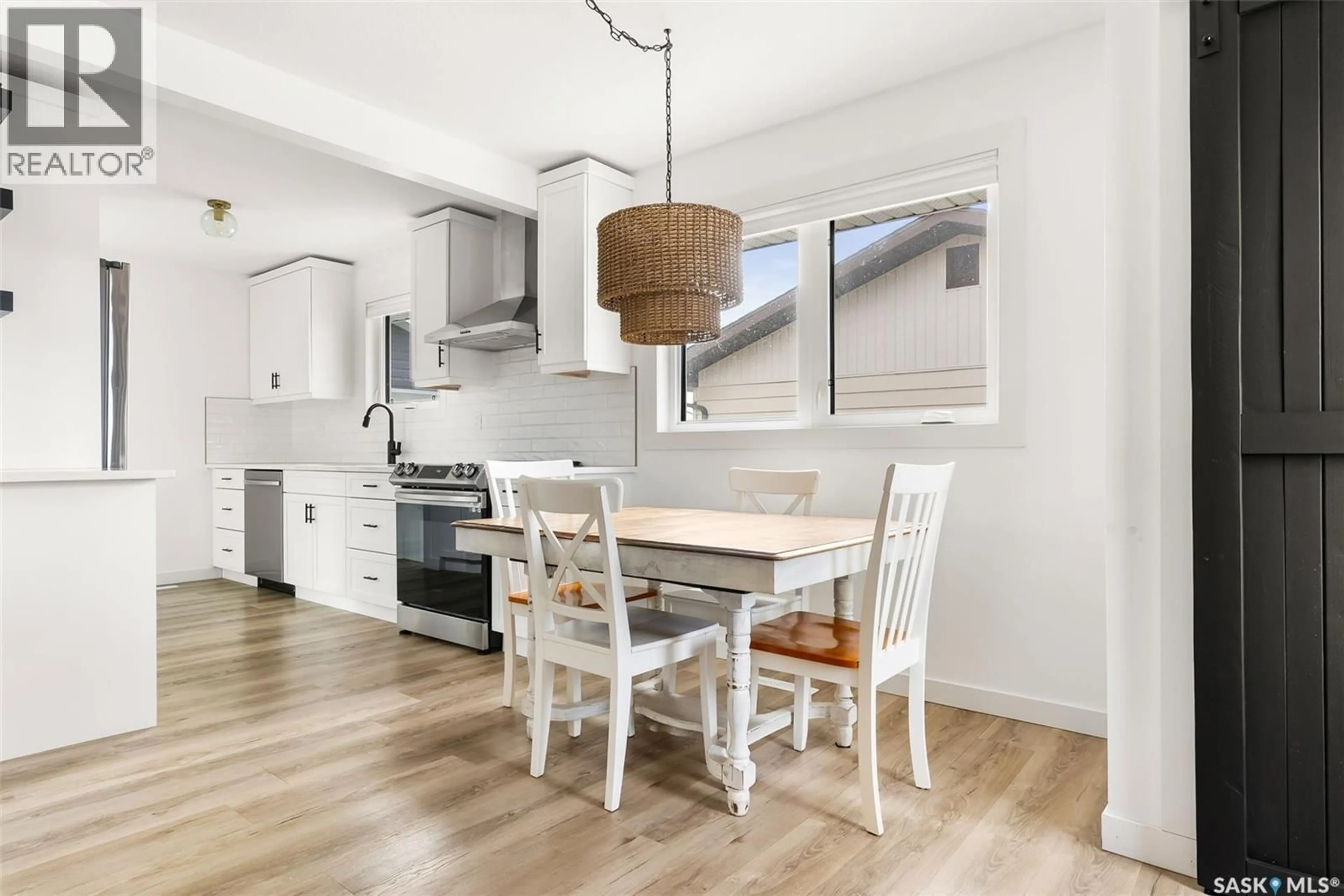 Open concept kitchen, wood/laminate floor for 73 COLDWELL ROAD, Regina Saskatchewan S4R4K4