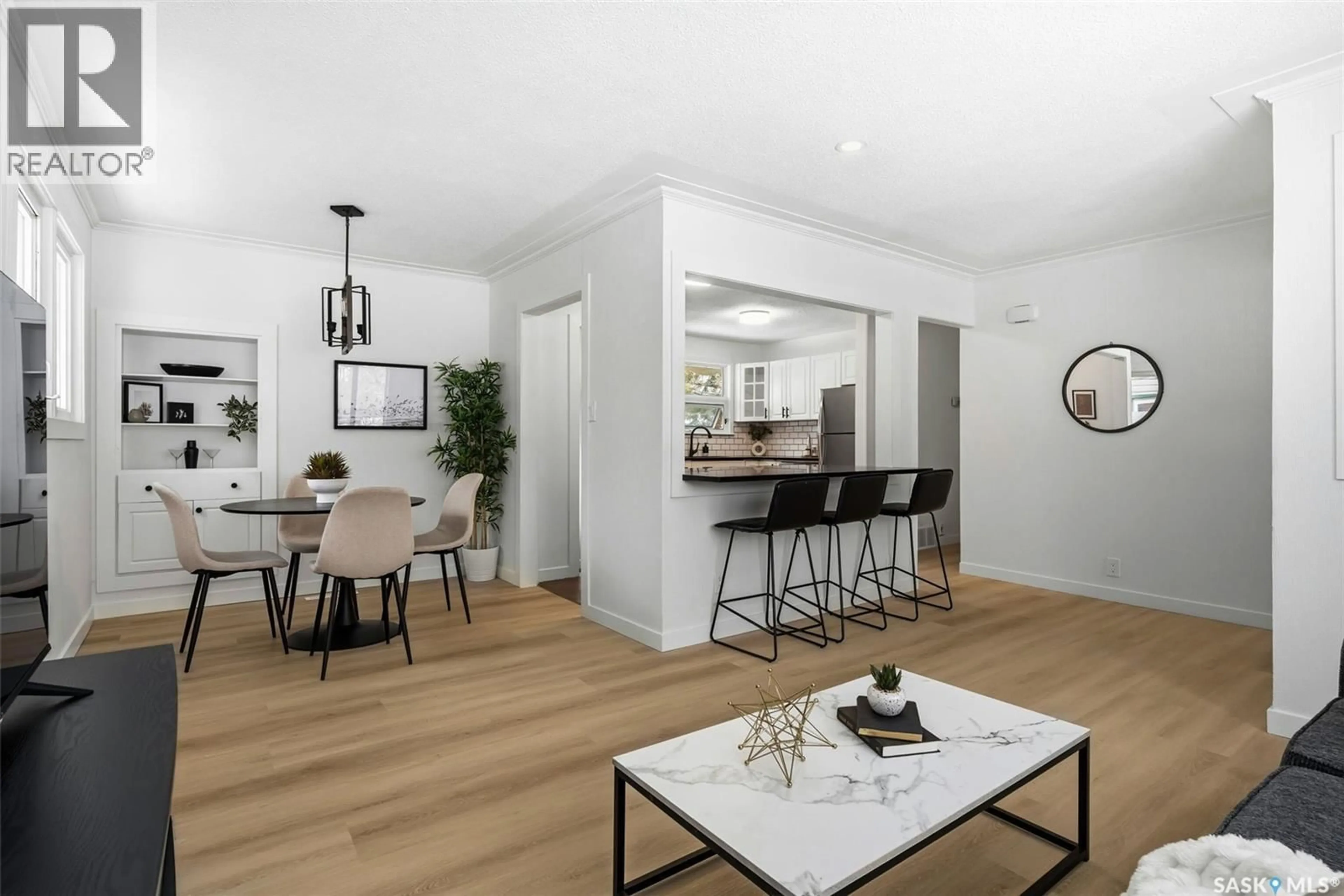 Open concept kitchen, wood/laminate floor for 5012 1ST AVENUE, Regina Saskatchewan S4T0A5