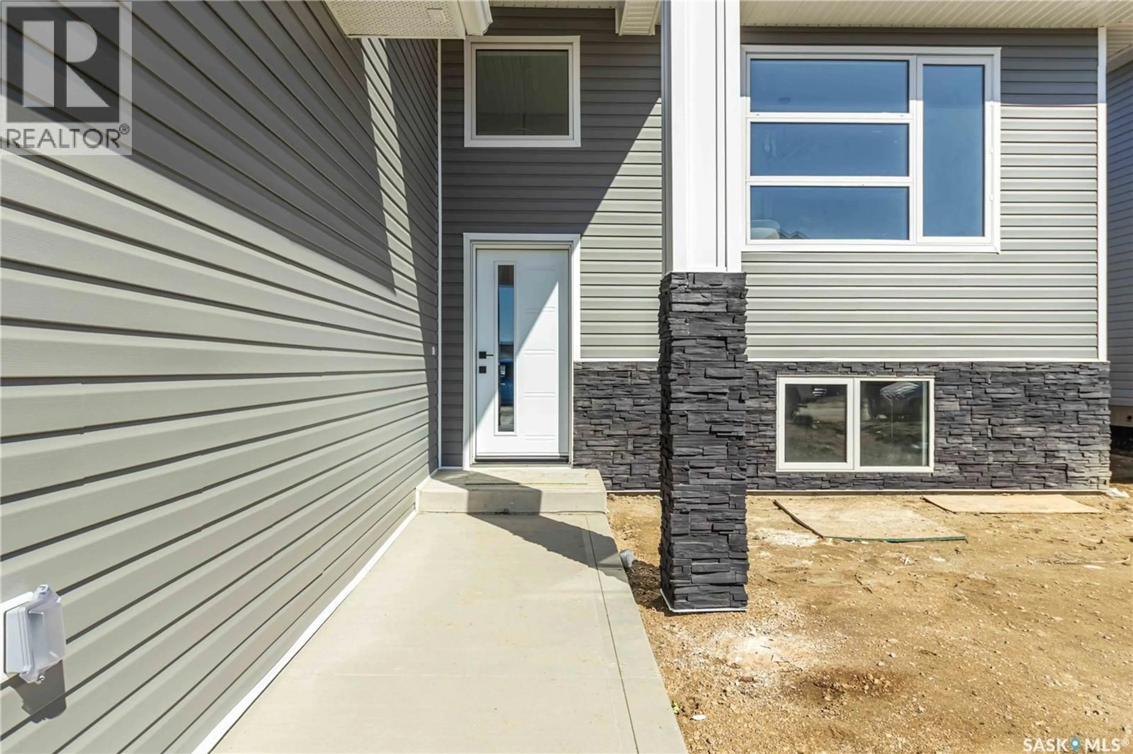 Home with vinyl exterior material, street for 836 BALLESTEROS CRESCENT, Warman Saskatchewan S0K4S4