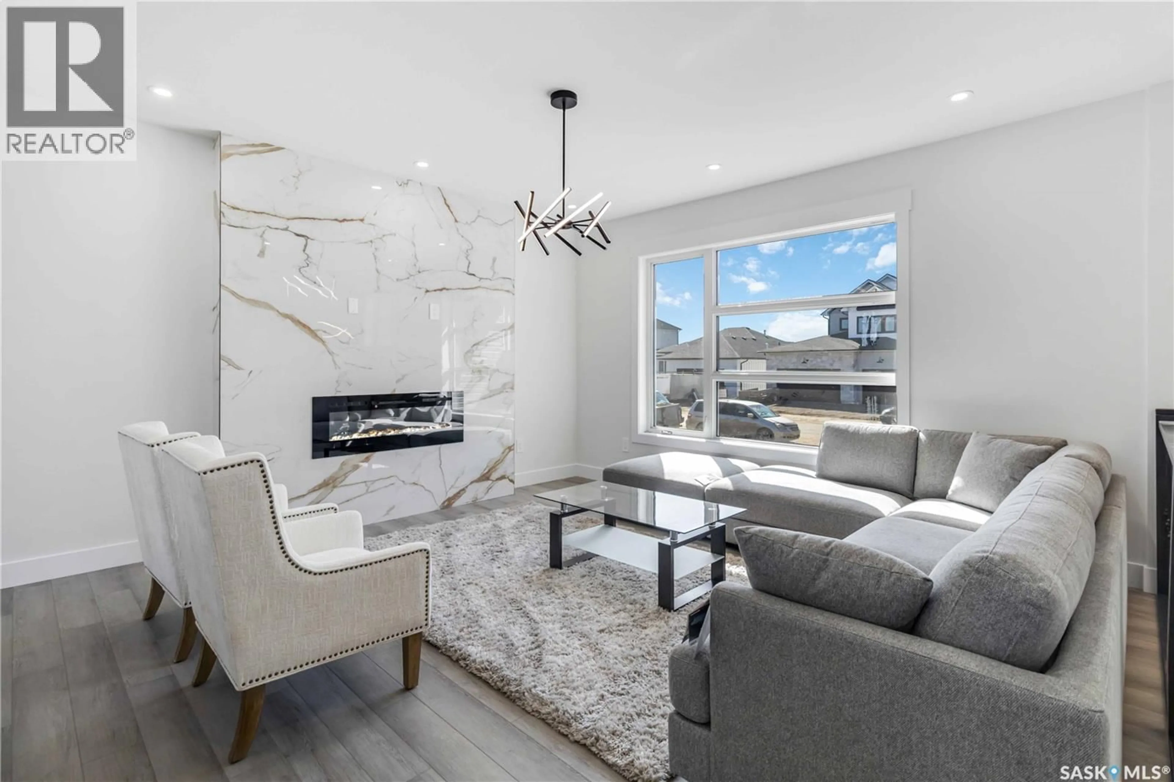 Living room with furniture, ceramic/tile floor for 838 BALLESTEROS CRESCENT, Warman Saskatchewan S0K4S4