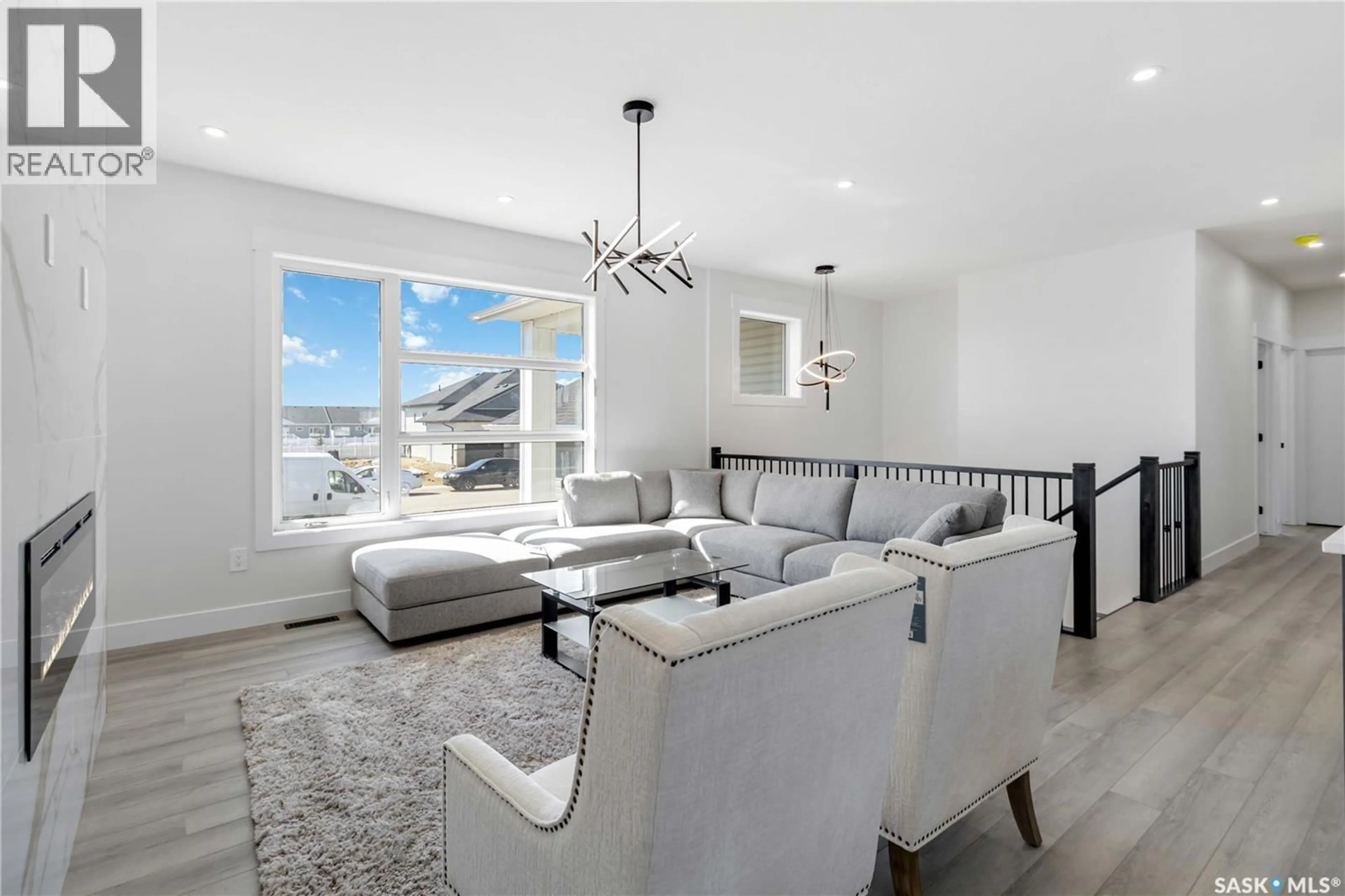 Living room with furniture, unknown for 838 BALLESTEROS CRESCENT, Warman Saskatchewan S0K4S4