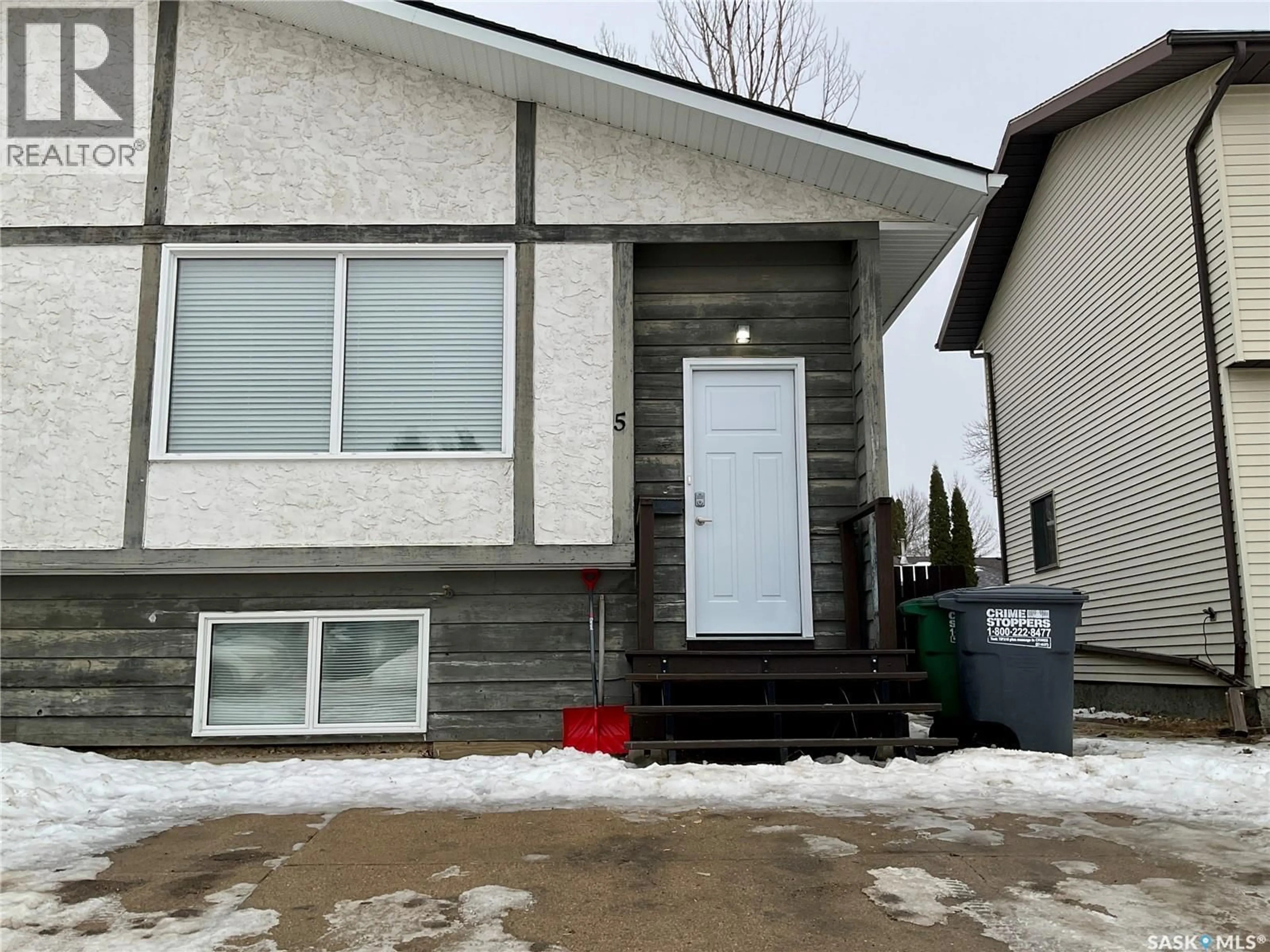 Home with vinyl exterior material, street for 5 DELARONDE TERRACE, Saskatoon Saskatchewan S7J3Y9