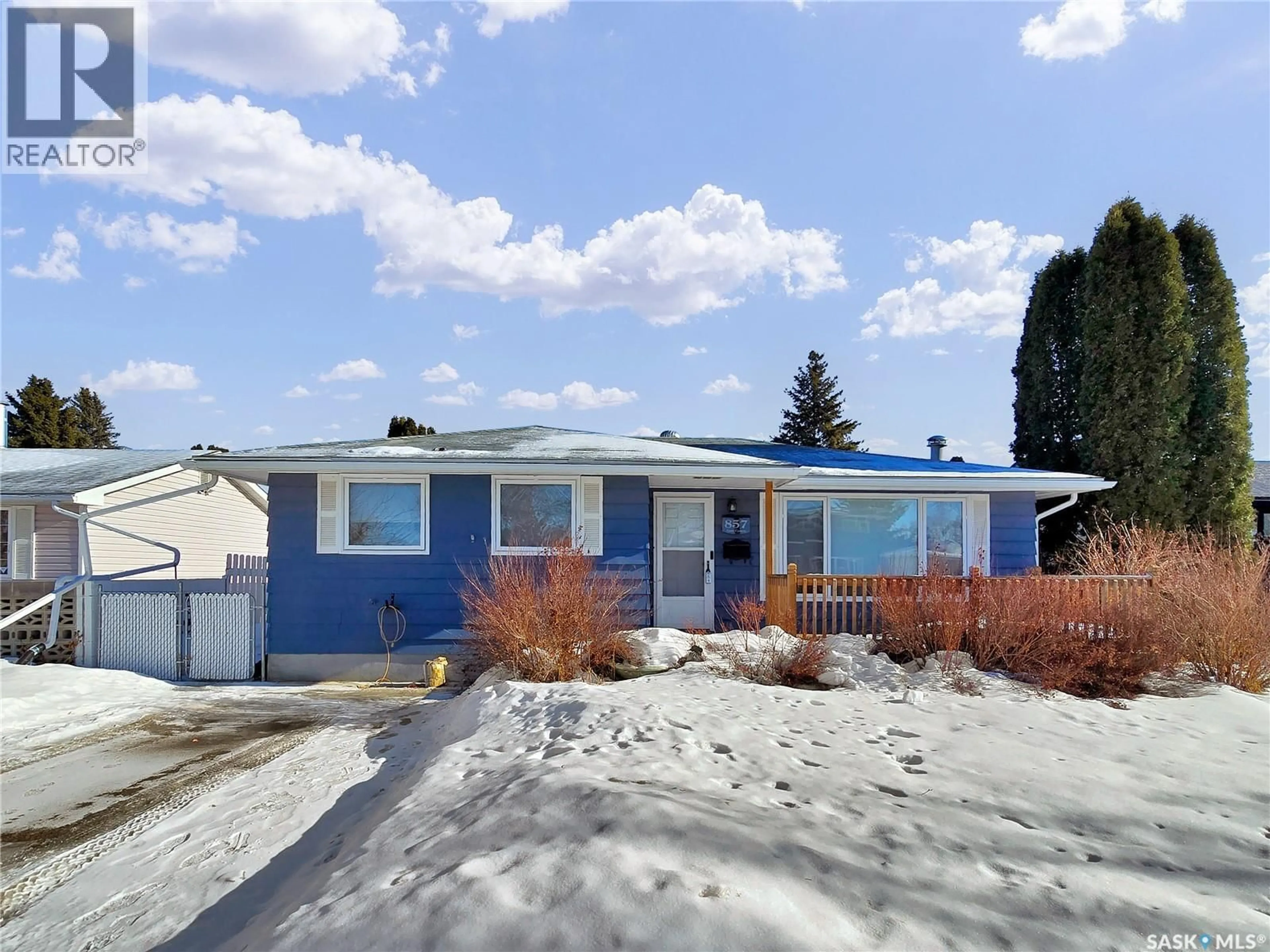 Home with vinyl exterior material, street for 857 CENTRE EAST, Saskatoon Saskatchewan S7J2Z8