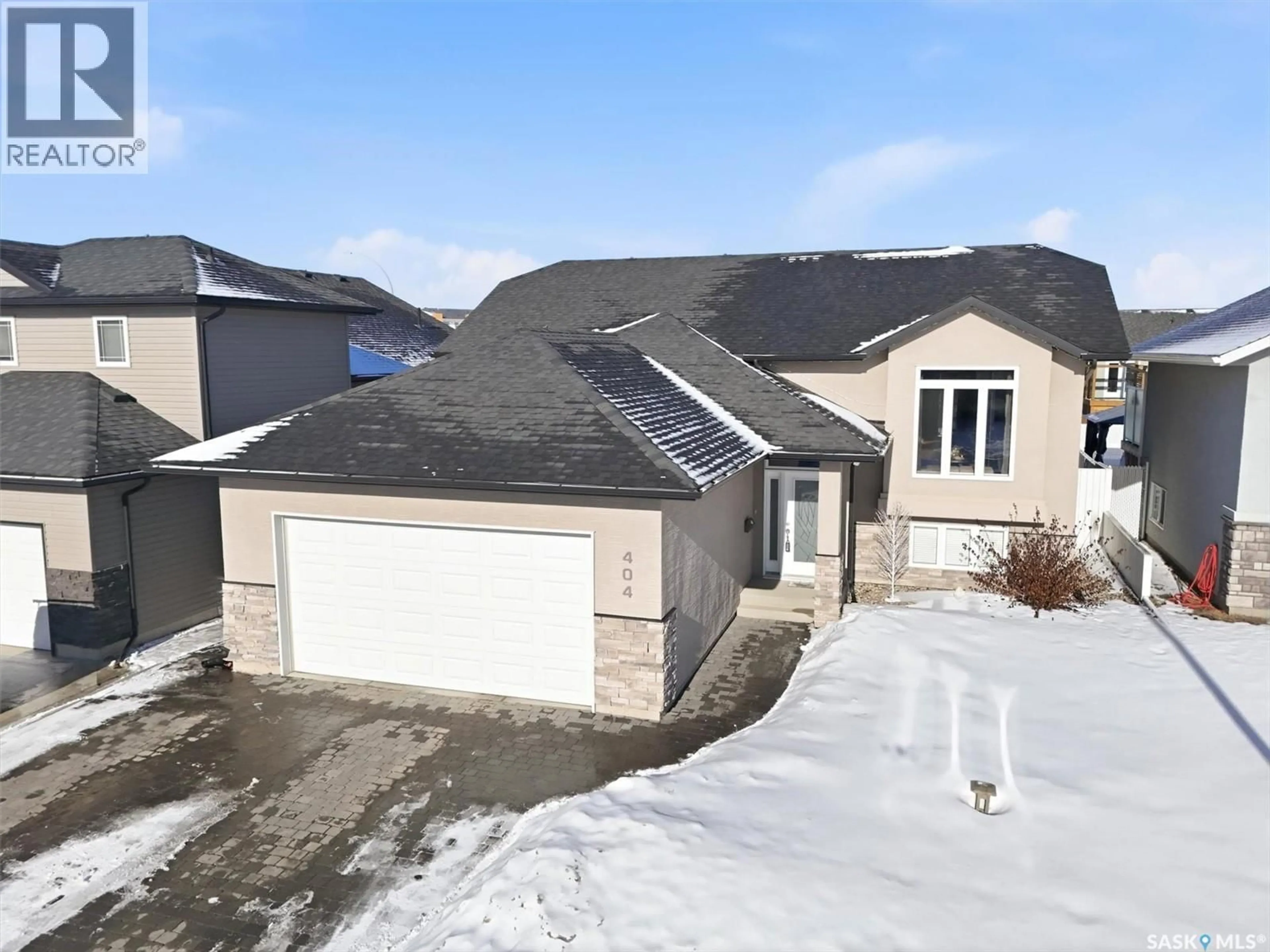 A pic from outside/outdoor area/front of a property/back of a property/a pic from drone, street for 404 LYLE CRESCENT, Warman Saskatchewan S0K4S1