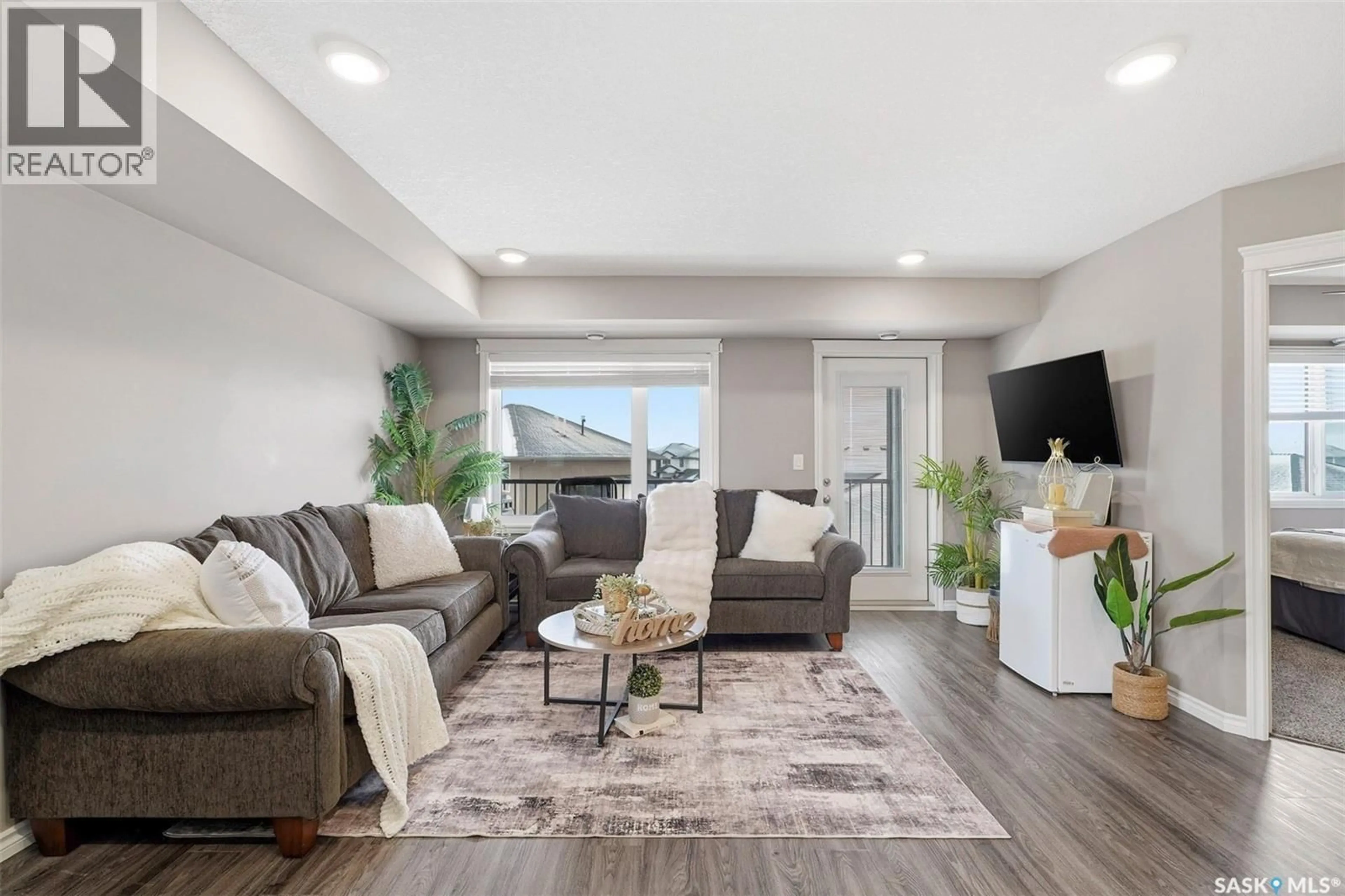 Living room with furniture, unknown for 507 110 AKHTAR BEND, Saskatoon Saskatchewan S7W0Y9