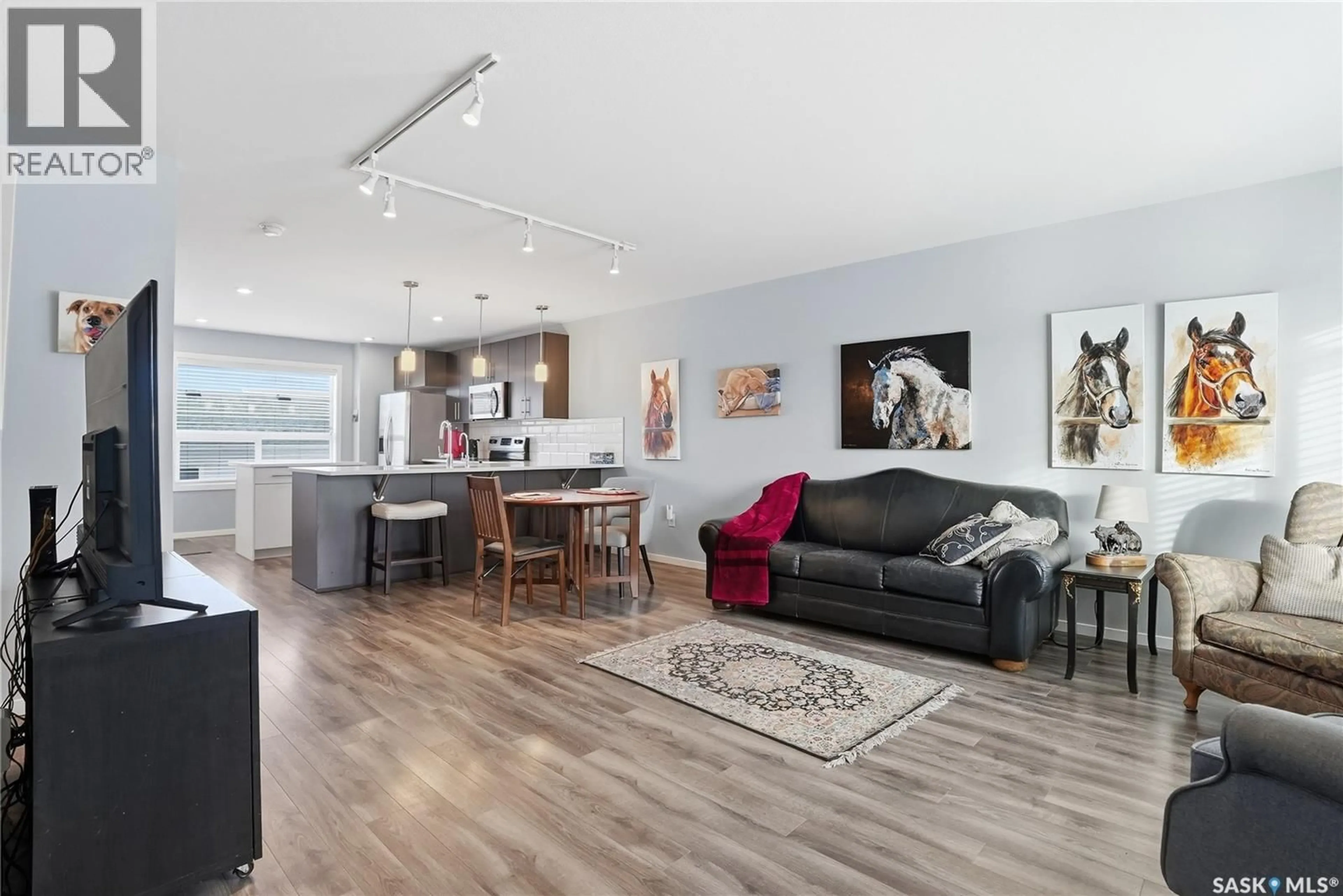 Open concept kitchen, wood/laminate floor for 4126 BRIGHTON CIRCLE, Saskatoon Saskatchewan S7V0M2