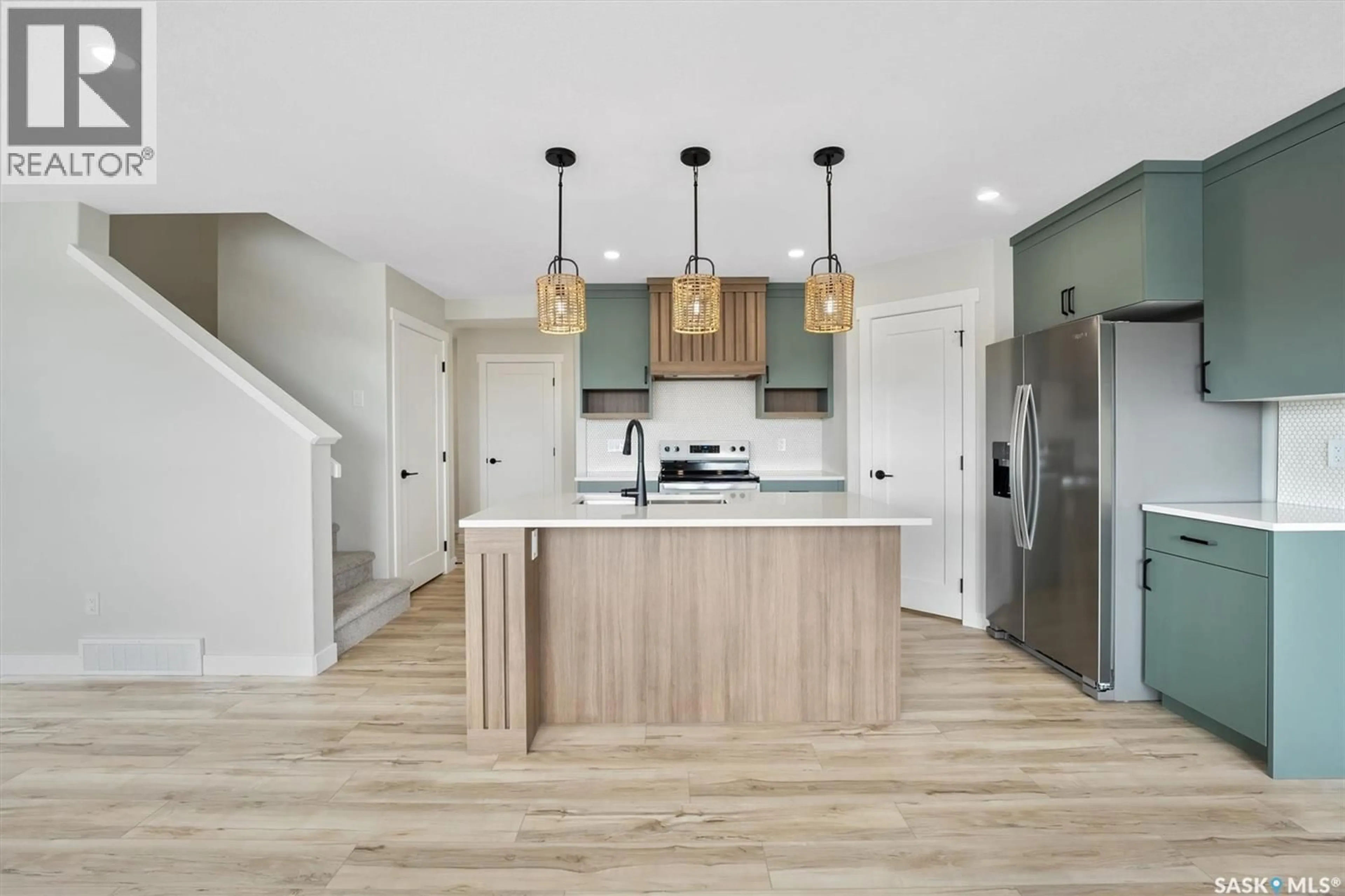 Open concept kitchen, wood/laminate floor for 2998 DUMONT WAY, Regina Saskatchewan S4V4E4