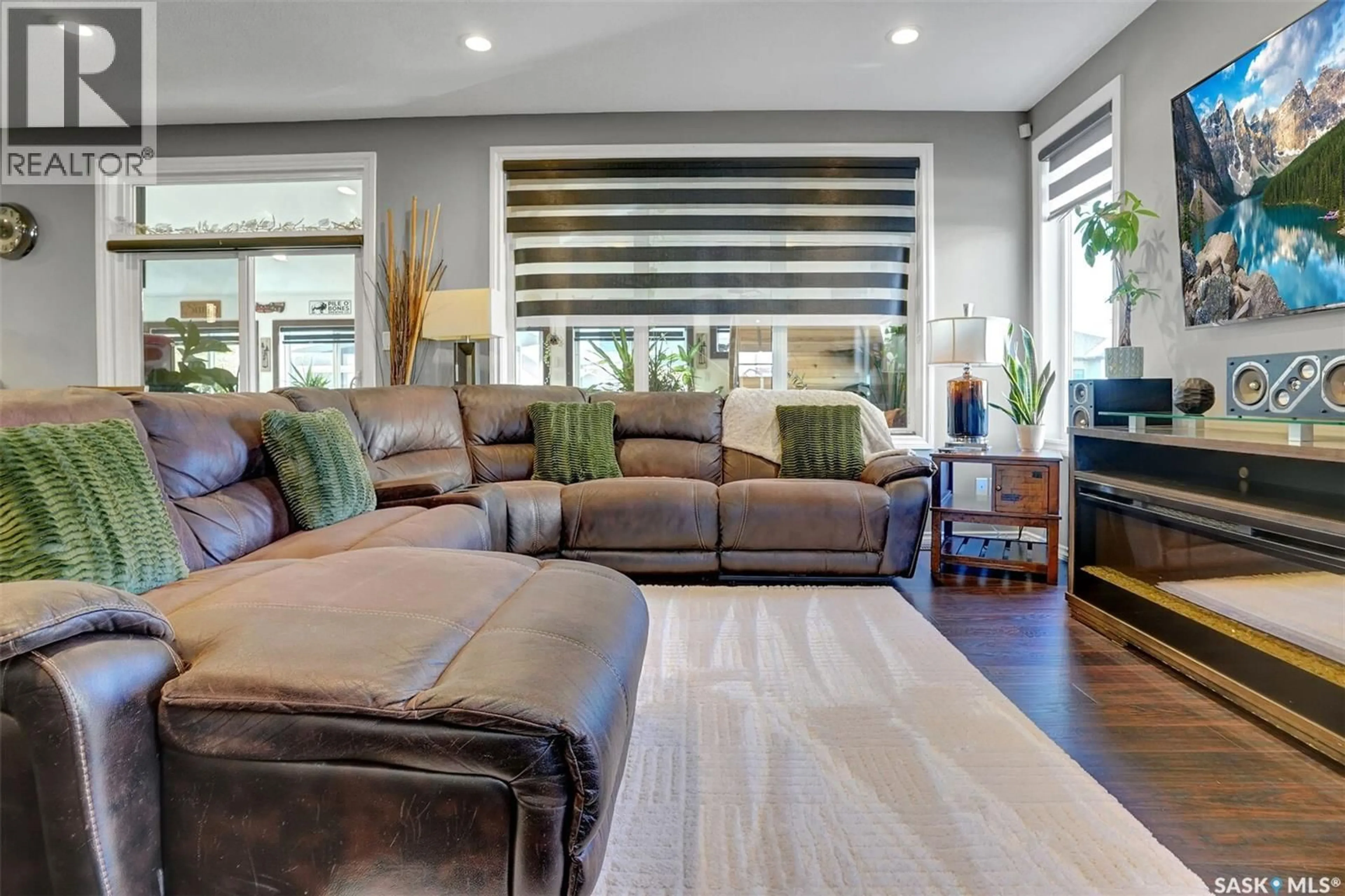 Living room with furniture, wood/laminate floor for 25 HUDSON DRIVE, Pilot Butte Saskatchewan S0G3Z0