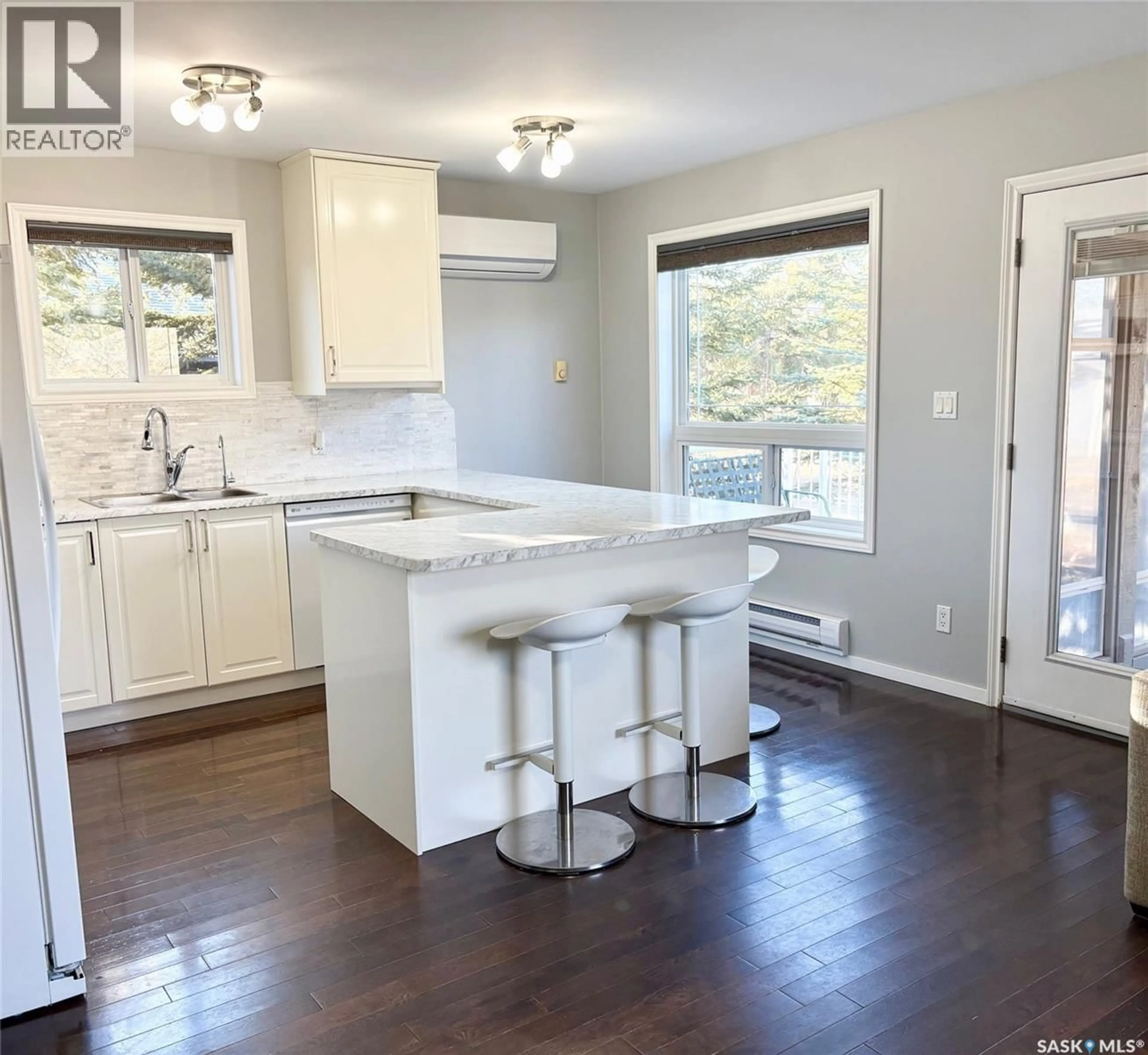 Open concept kitchen, wood/laminate floor for 408 OLDROYD DRIVE, Good Spirit Lake Saskatchewan S0A0L0