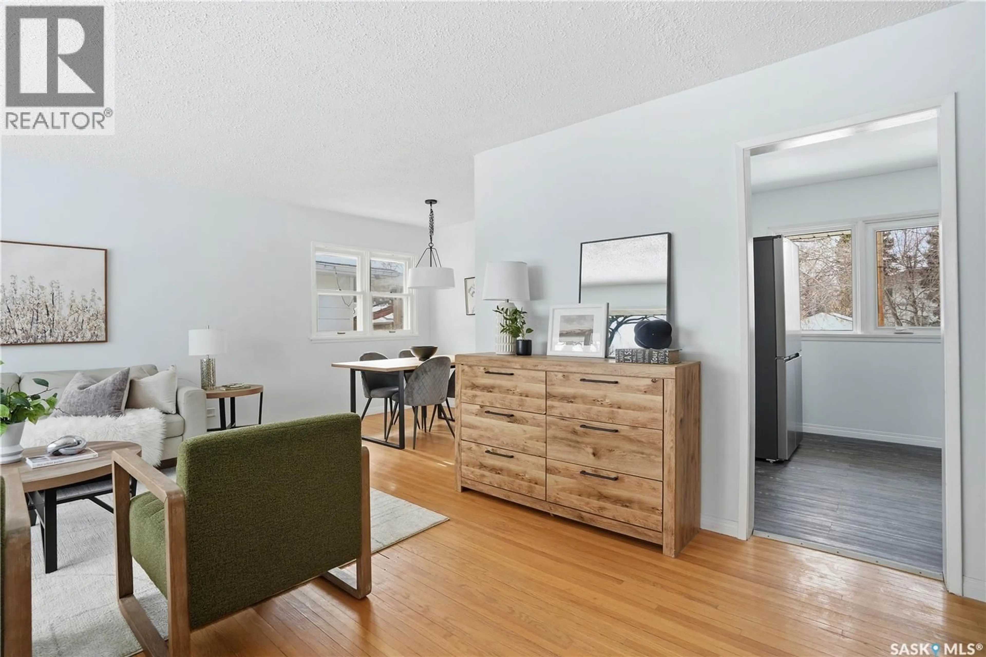 Living room with furniture, wood/laminate floor for 3224 ATHOL STREET, Regina Saskatchewan S4S1Y9