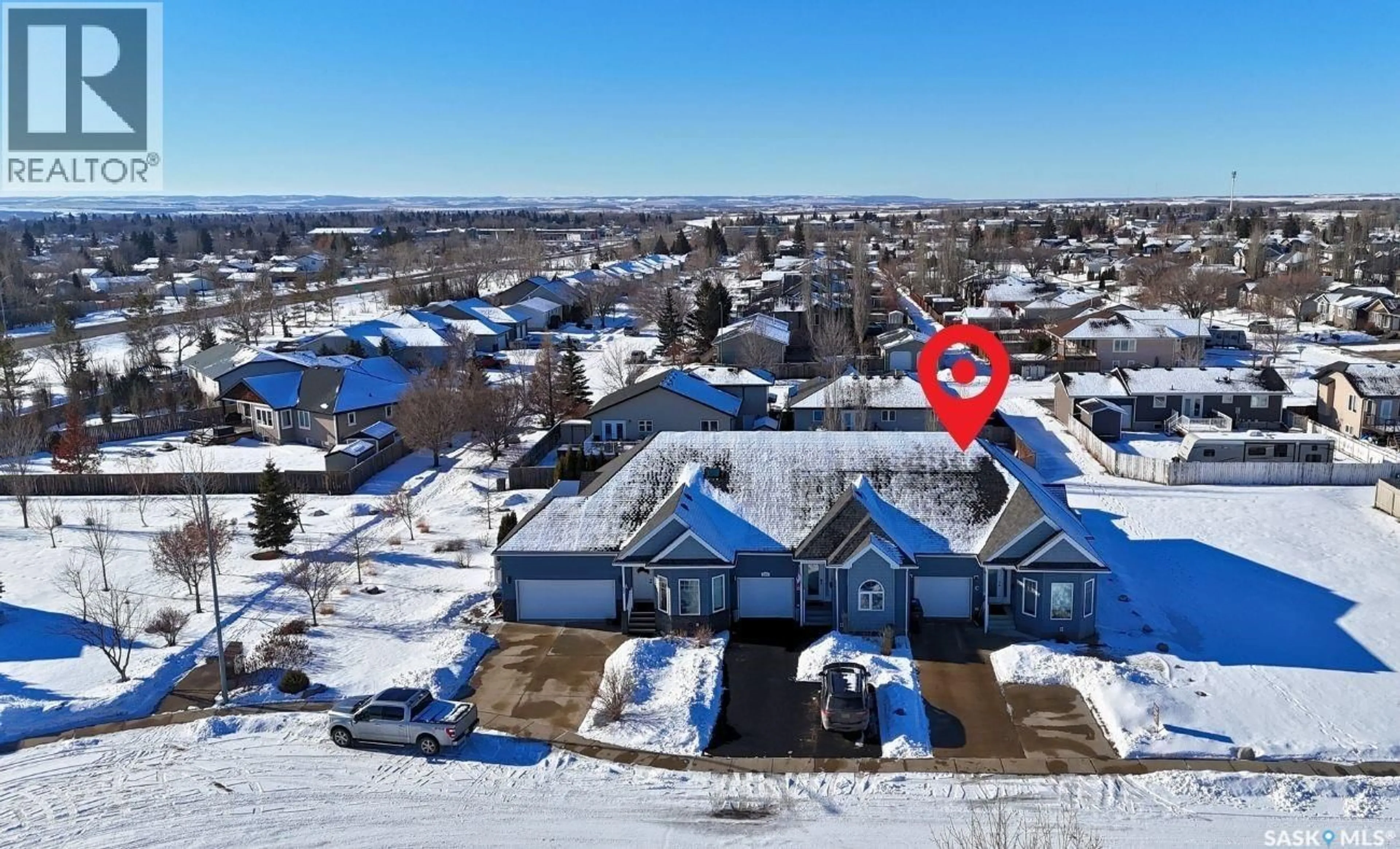 A pic from outside/outdoor area/front of a property/back of a property/a pic from drone, unknown for 2301 C AMOS DRIVE, North Battleford Saskatchewan S9A1B6