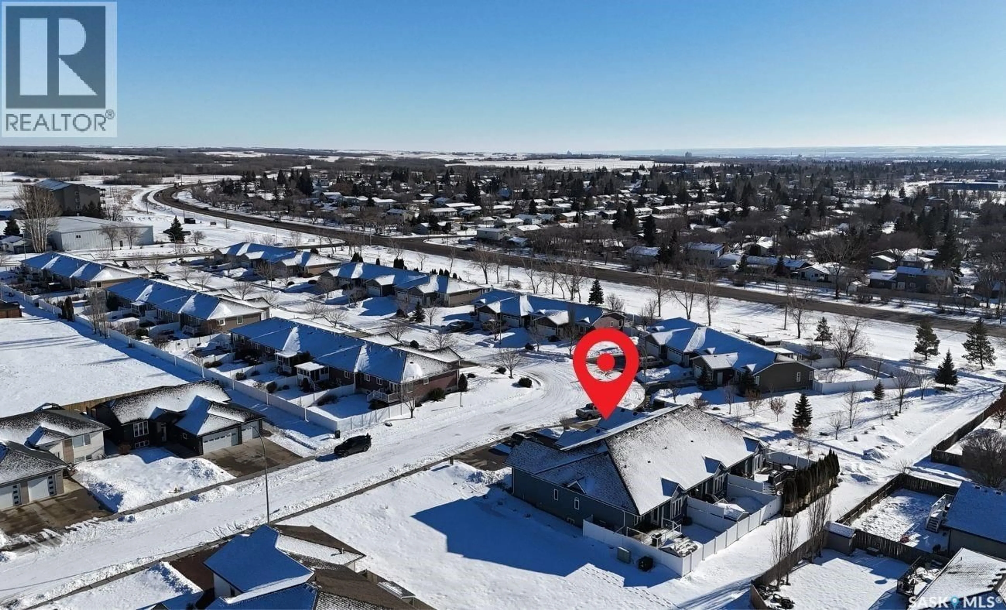 A pic from outside/outdoor area/front of a property/back of a property/a pic from drone, mountain view for 2301 C AMOS DRIVE, North Battleford Saskatchewan S9A1B6