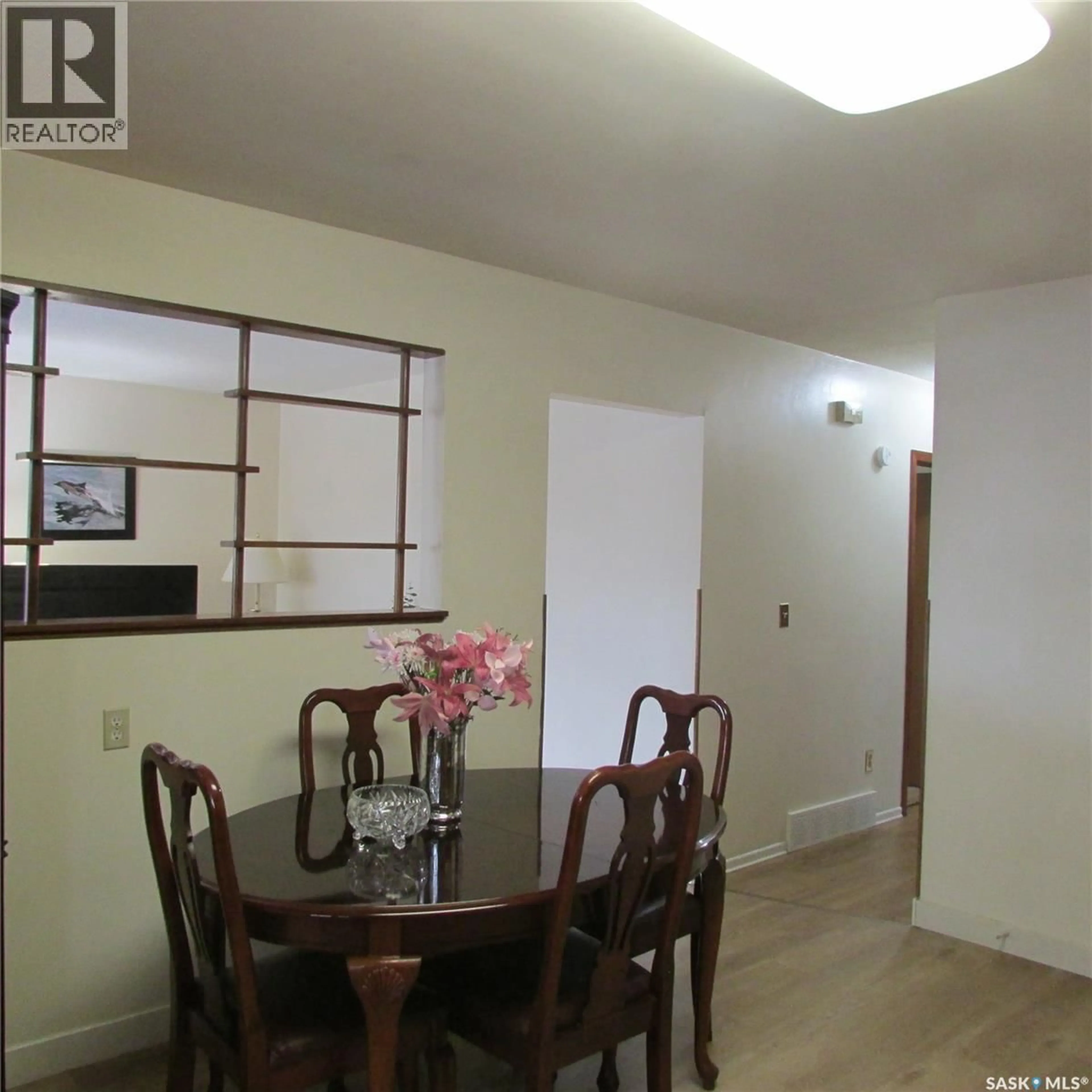 Dining room, wood/laminate floor for 139 SMITH STREET, Regina Saskatchewan S4R3B3