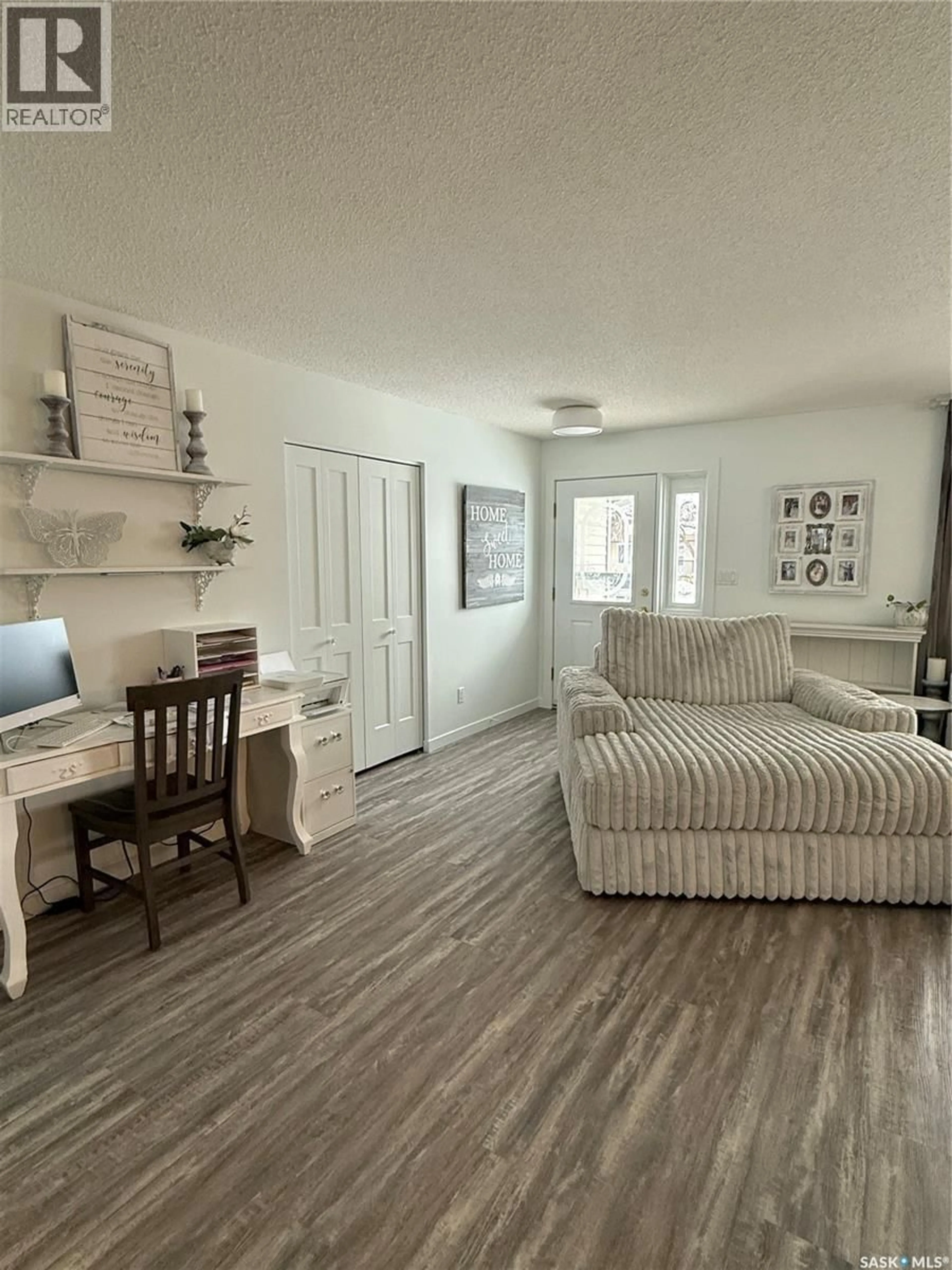 Living room with furniture, wood/laminate floor for 116 ELIZABETH AVENUE, Yorkton Saskatchewan S3N2E3