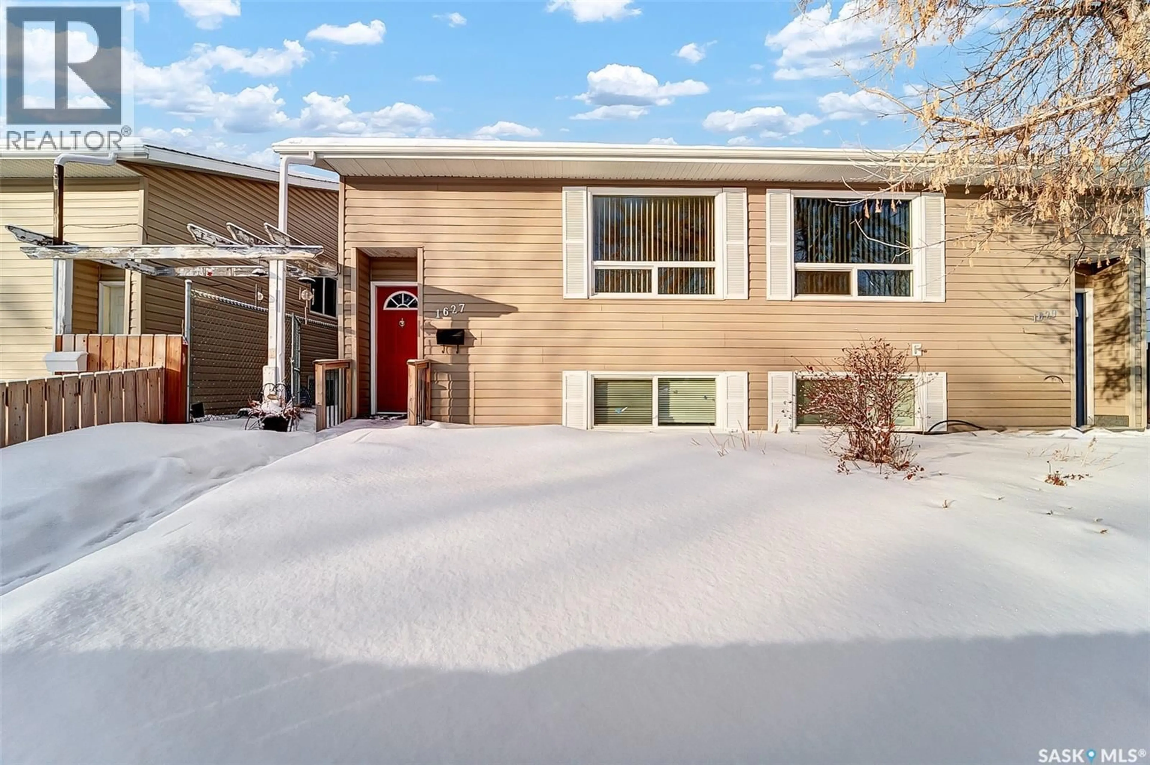 Home with vinyl exterior material, street for 1627-1629 B AVENUE, Saskatoon Saskatchewan S7L1H2