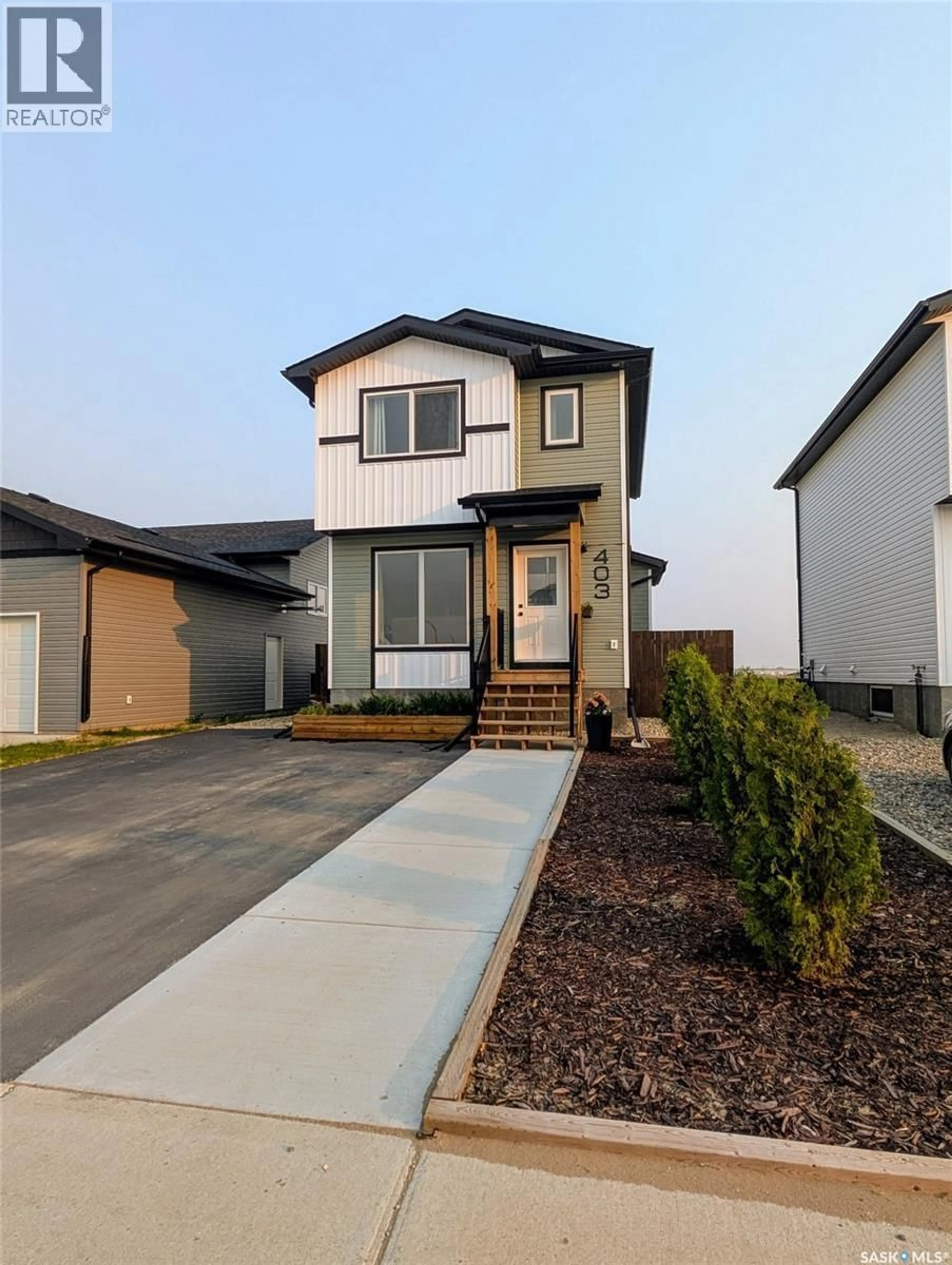 Home with vinyl exterior material, street for 403 ELDORADO STREET, Warman Saskatchewan S0K4S3