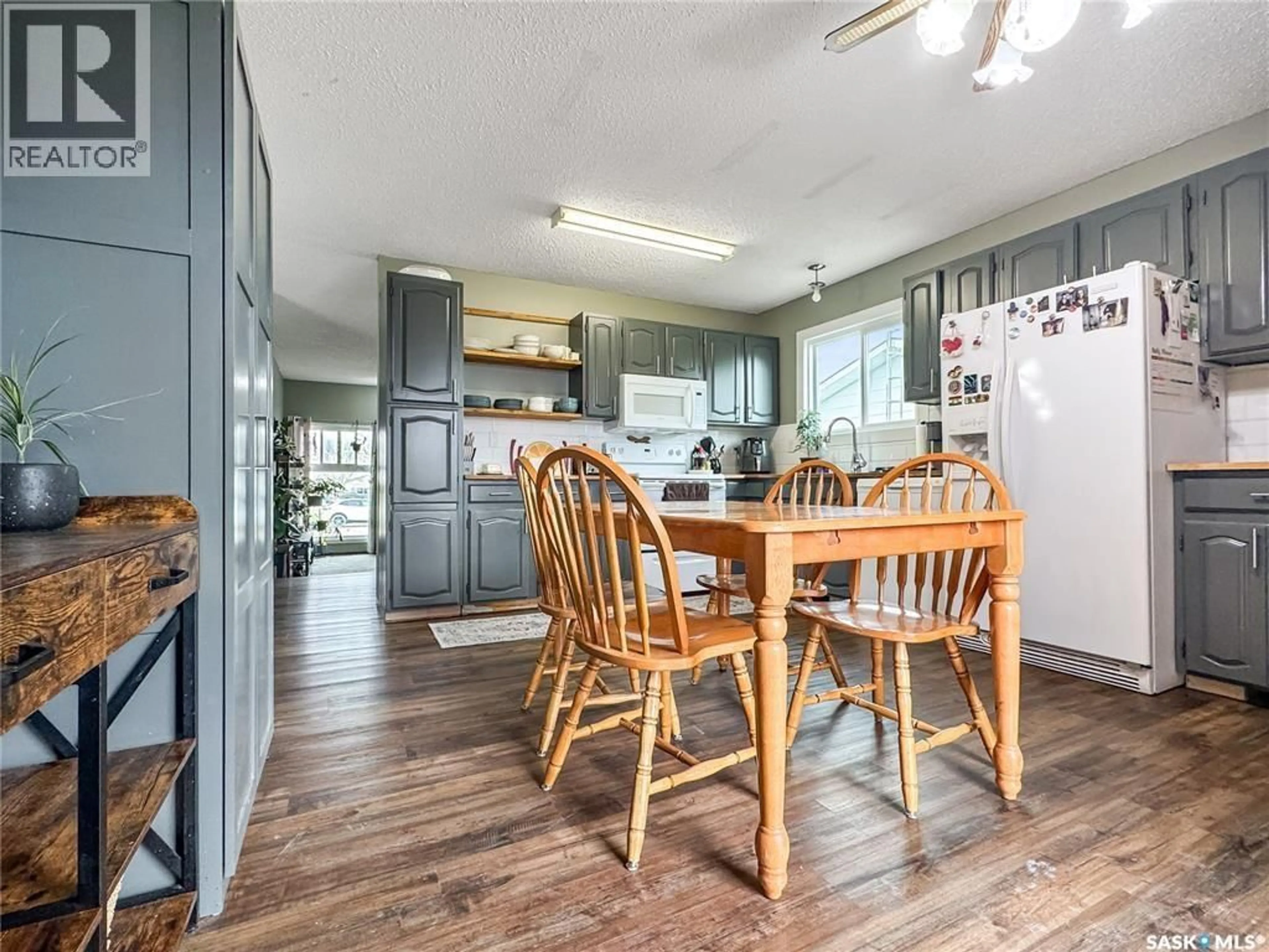Open concept kitchen, wood/laminate floor for 321 ARTHUR STREET, Cut Knife Saskatchewan S0M0N0