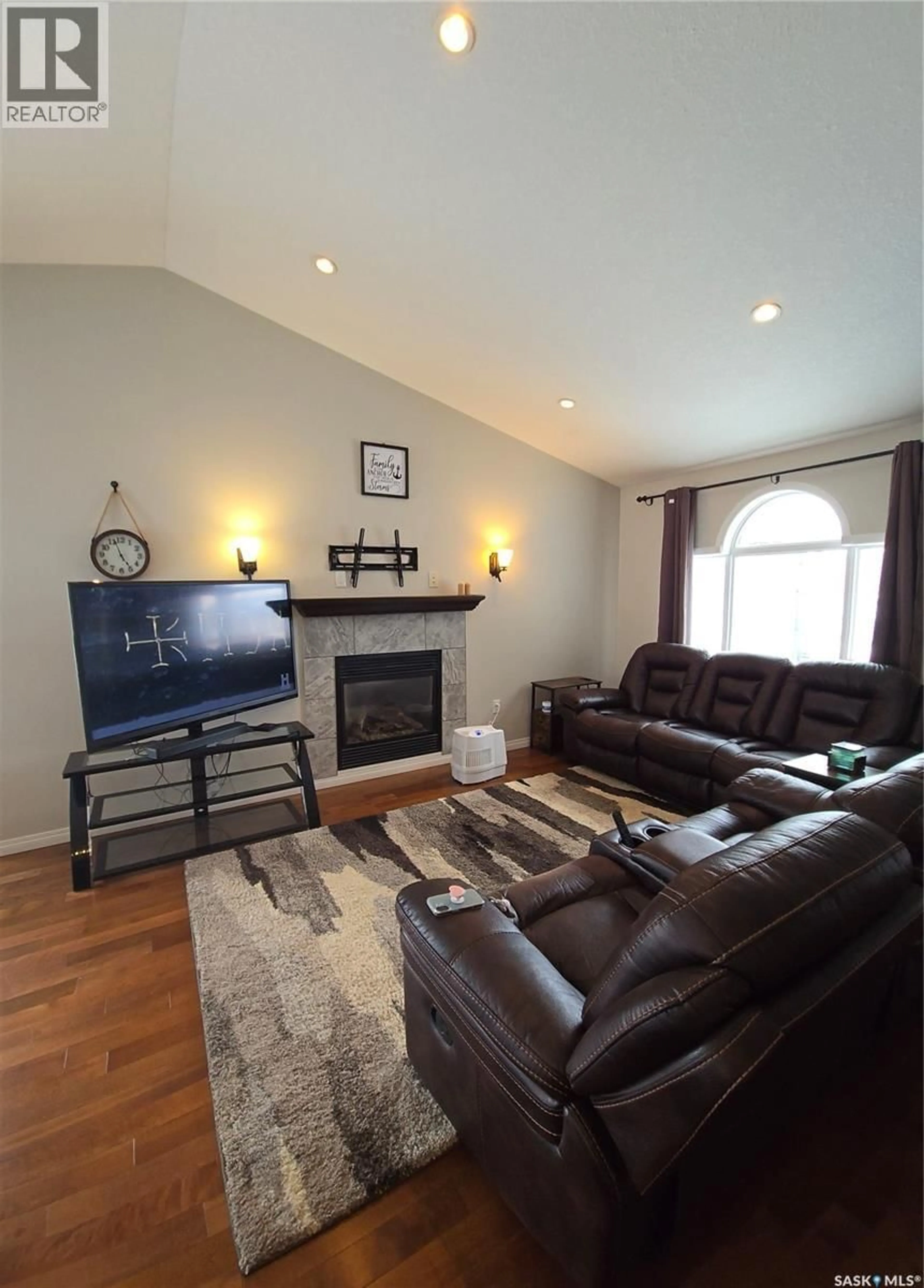 Living room with furniture, wood/laminate floor for 8 MAIN BAY, Muenster Saskatchewan S0K2Y0